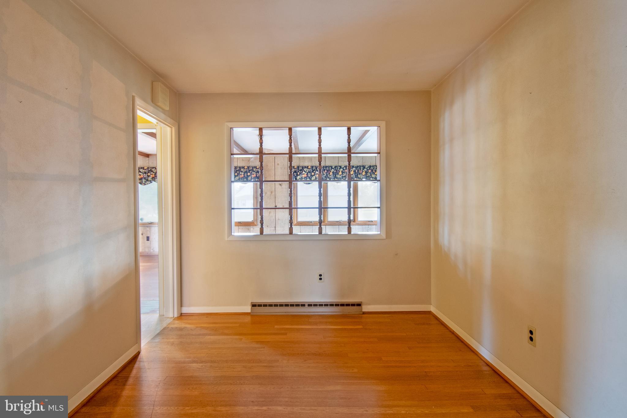 18532 Johnson Road Lincoln, DE 19960 - Photo 36 of 55 a view of an empty room with wooden floor and a window