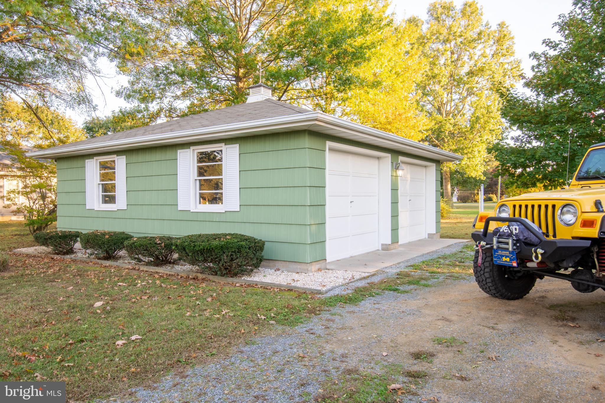 18532 Johnson Road Lincoln, DE 19960 - Photo 10 of 55 a front view of a house with garden