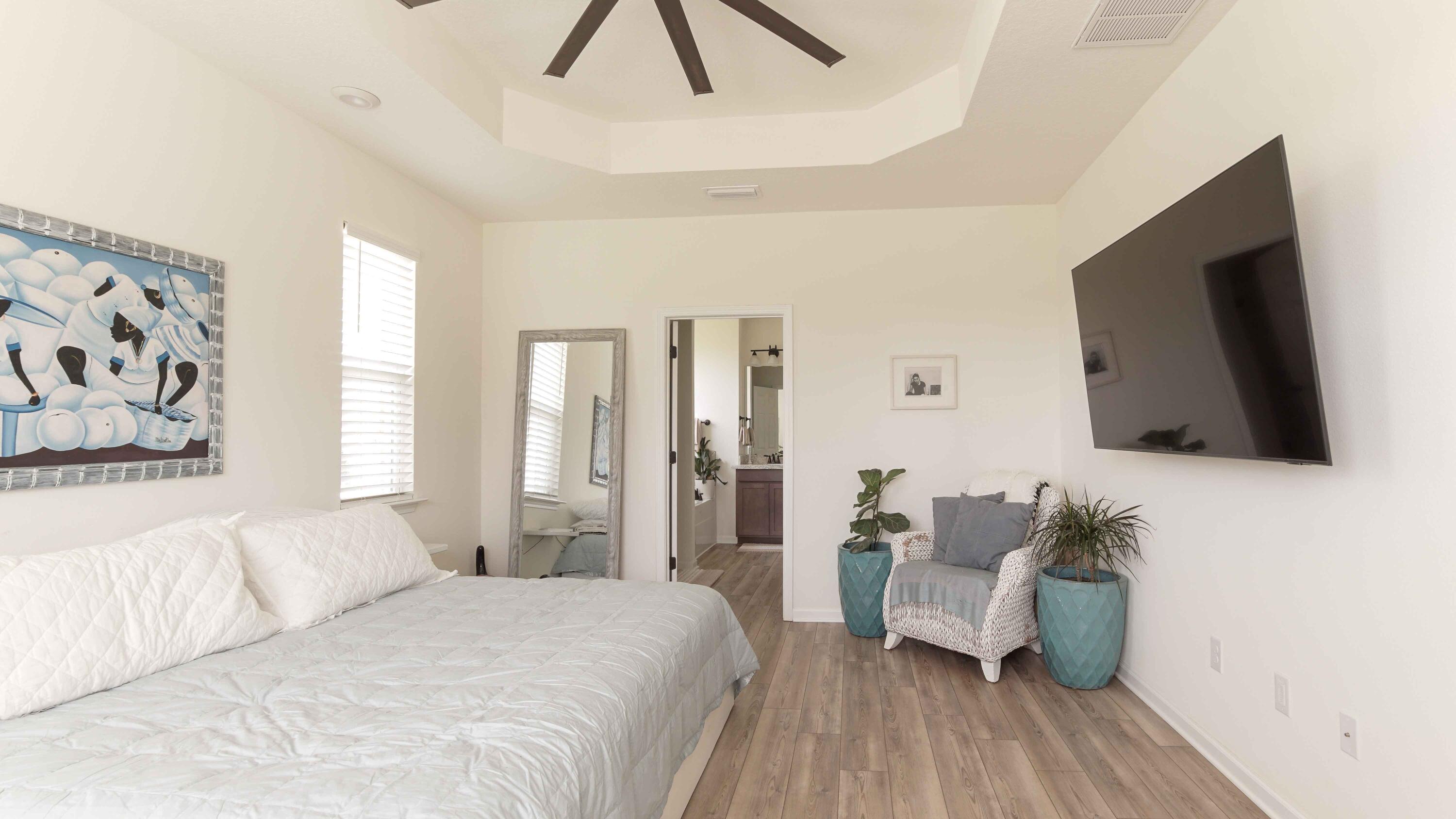 322 Fairway Crossing Freeport, FL 32439 - Photo 20 of 56 a bedroom with a bed and flat screen tv