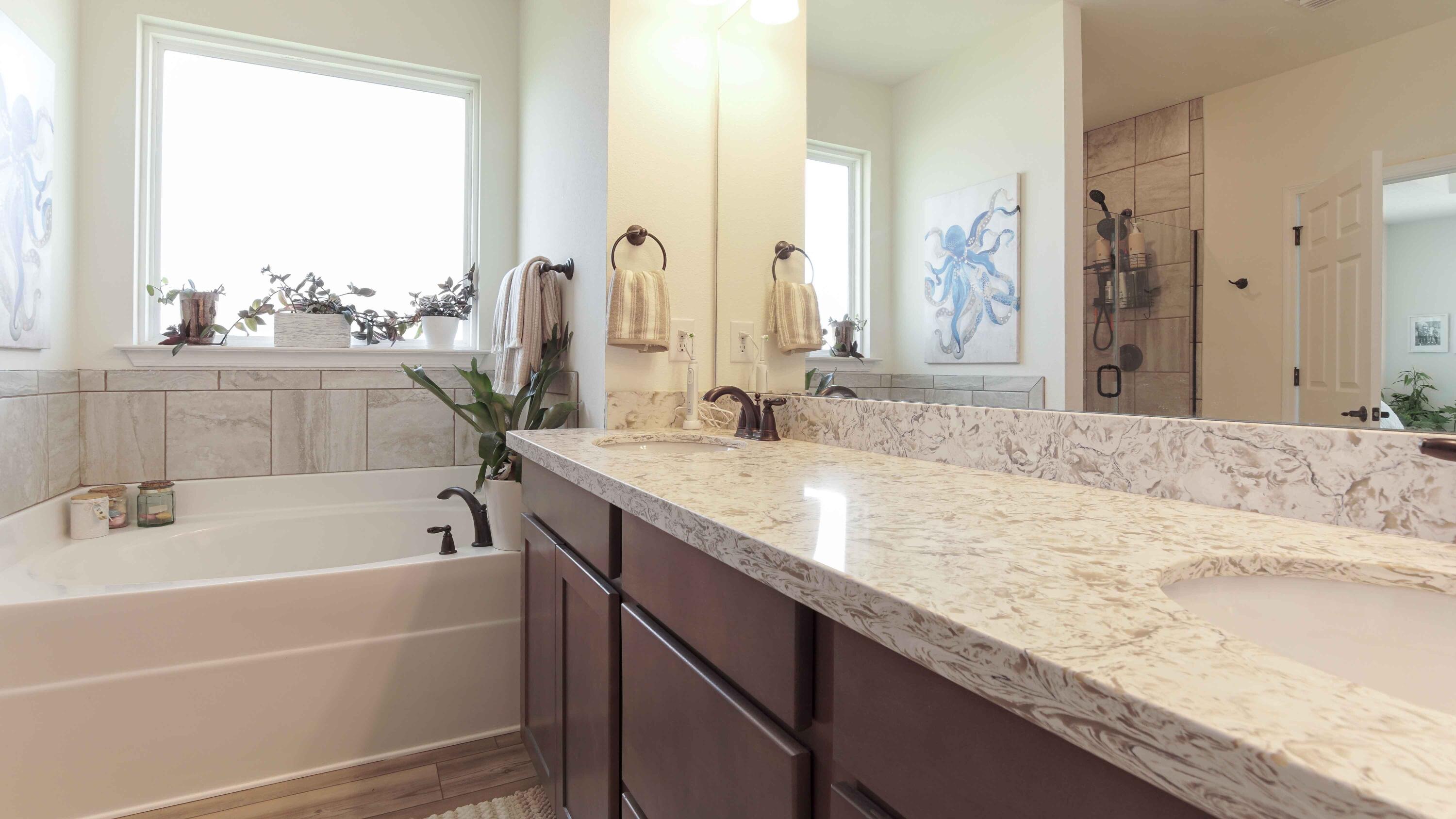 322 Fairway Crossing Freeport, FL 32439 - Photo 26 of 56 a bathroom with a granite countertop sink and a bathtub