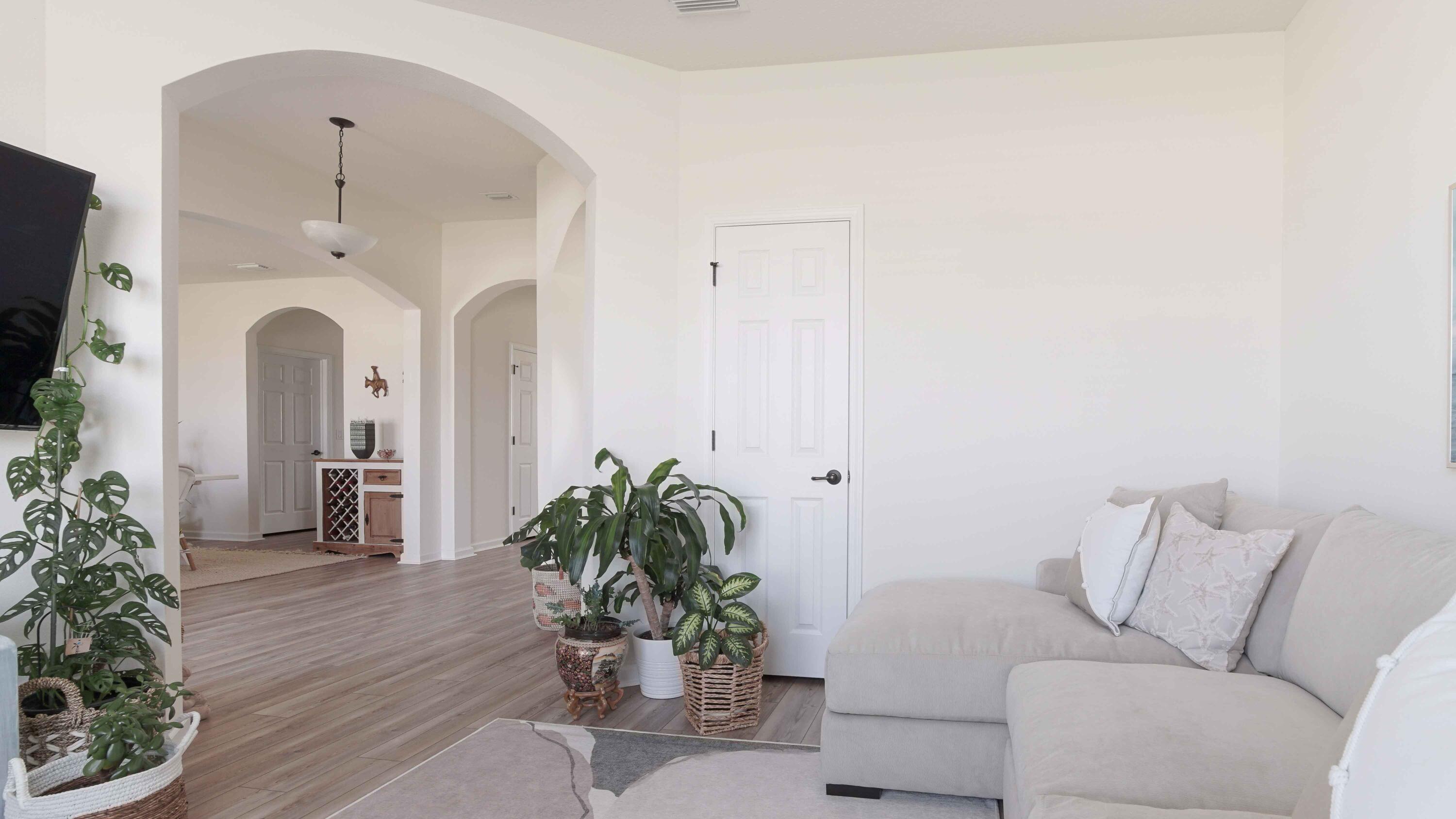 322 Fairway Crossing Freeport, FL 32439 - Photo 28 of 56 a living room with furniture and a chandelier