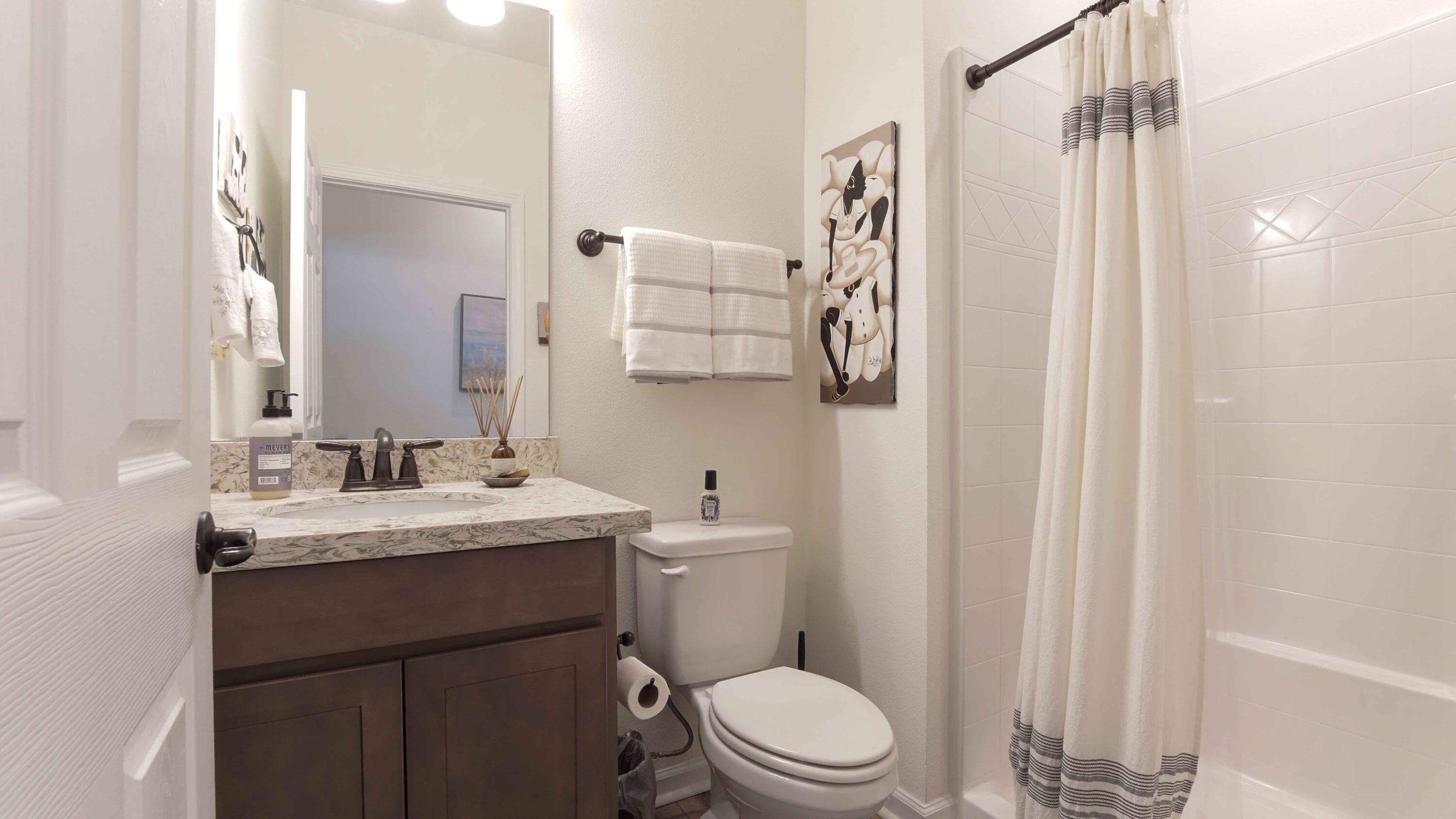 322 Fairway Crossing Freeport, FL 32439 - Photo 30 of 56 a bathroom with a granite countertop sink toilet and shower