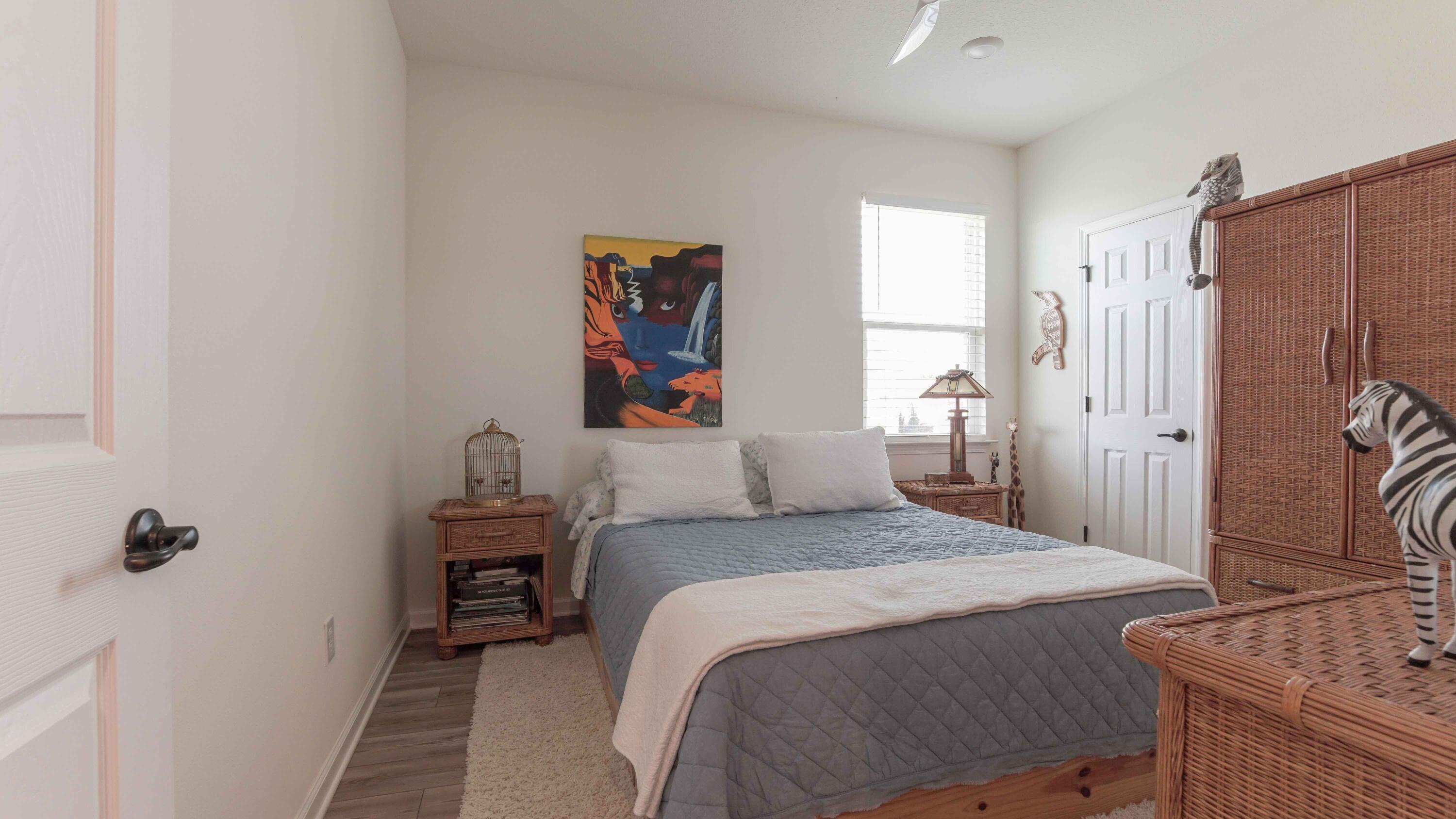 322 Fairway Crossing Freeport, FL 32439 - Photo 31 of 56 a bedroom with a bed and a dresser