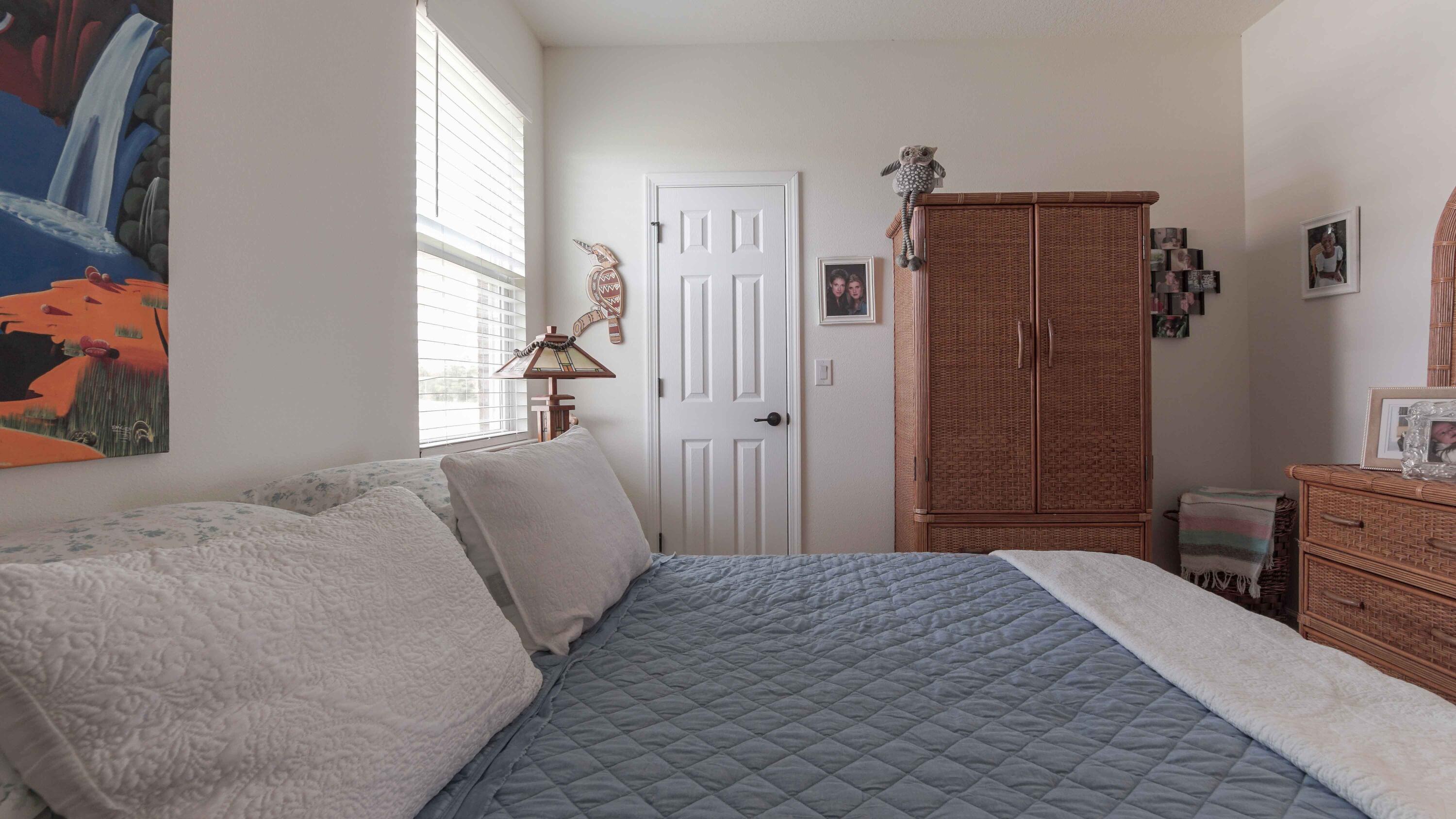 322 Fairway Crossing Freeport, FL 32439 - Photo 32 of 56 a bedroom with a bed dresser and a window