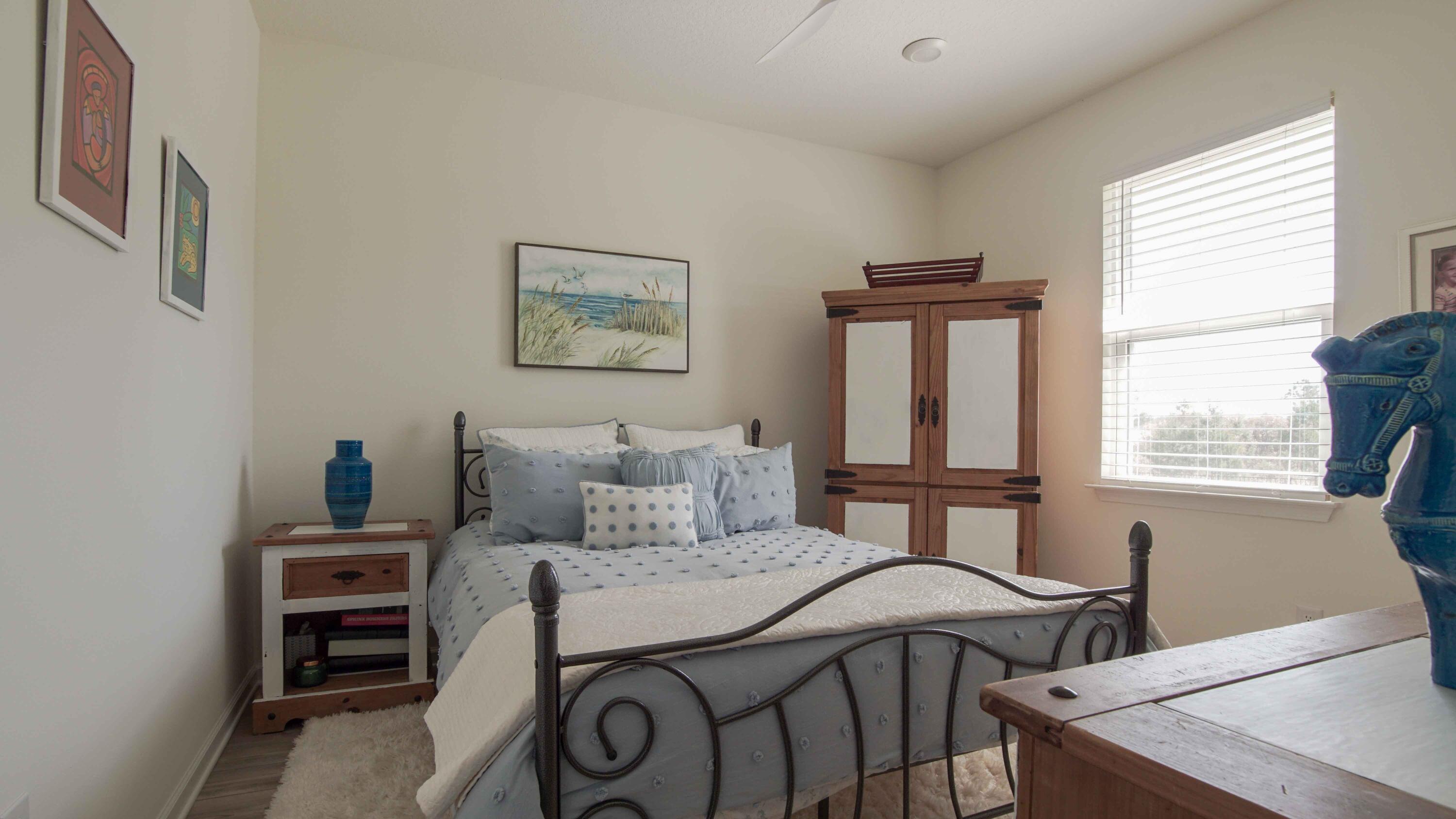 322 Fairway Crossing Freeport, FL 32439 - Photo 34 of 56 a bedroom with a bed and a window