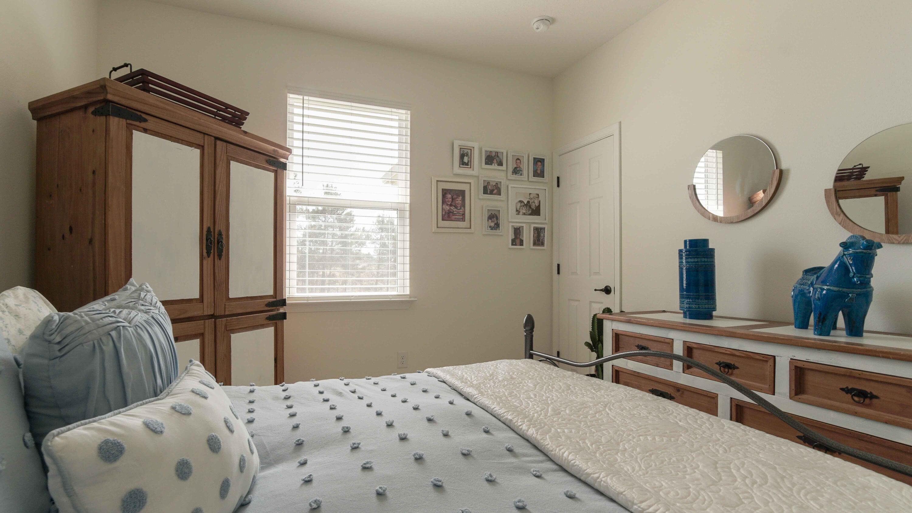 322 Fairway Crossing Freeport, FL 32439 - Photo 35 of 56 a bedroom with a bed and window