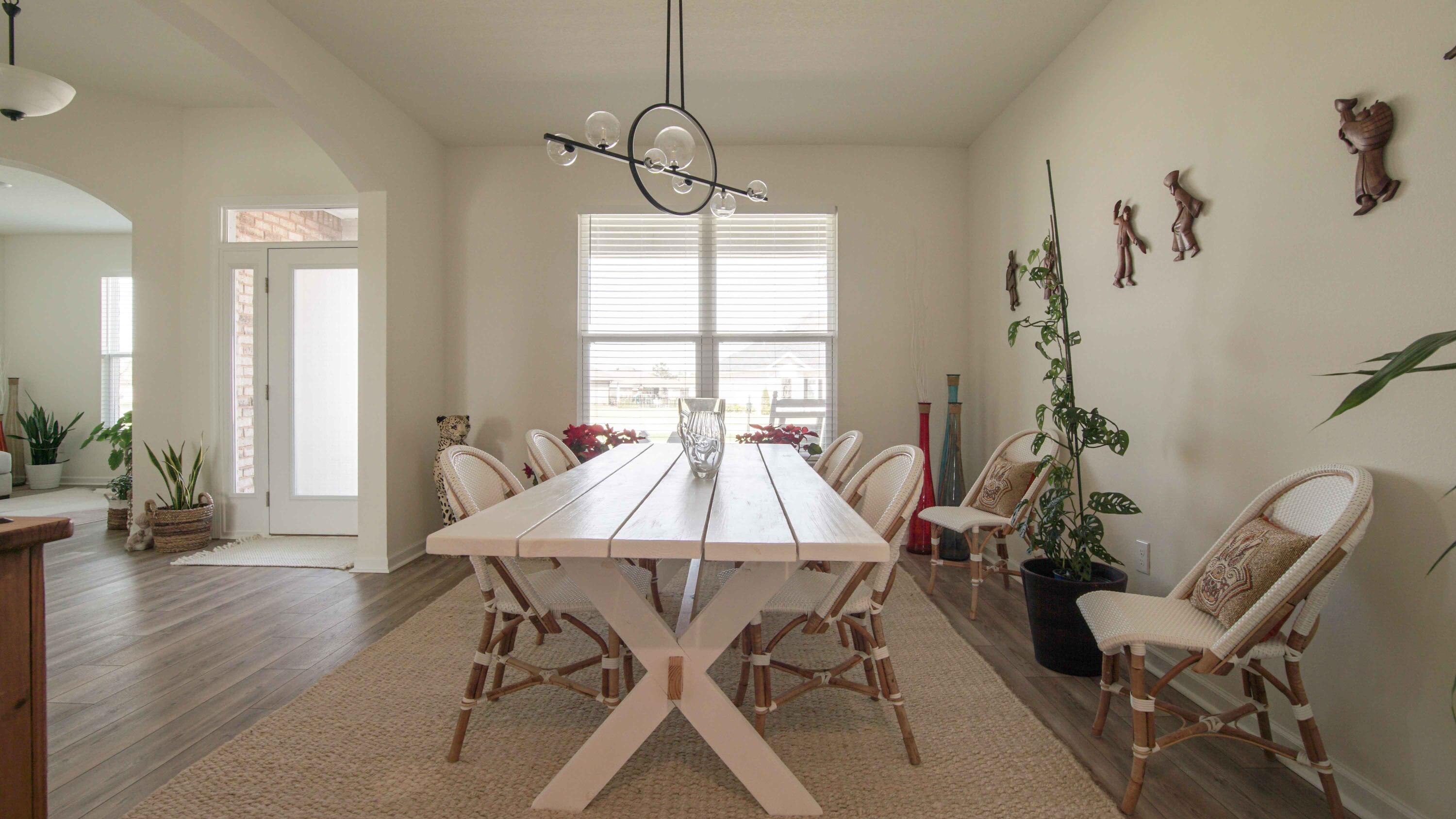 322 Fairway Crossing Freeport, FL 32439 - Photo 7 of 56 a view of a dining room with furniture window and wooden floor