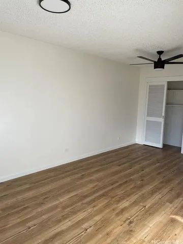 a view of a room with wooden floor and sink