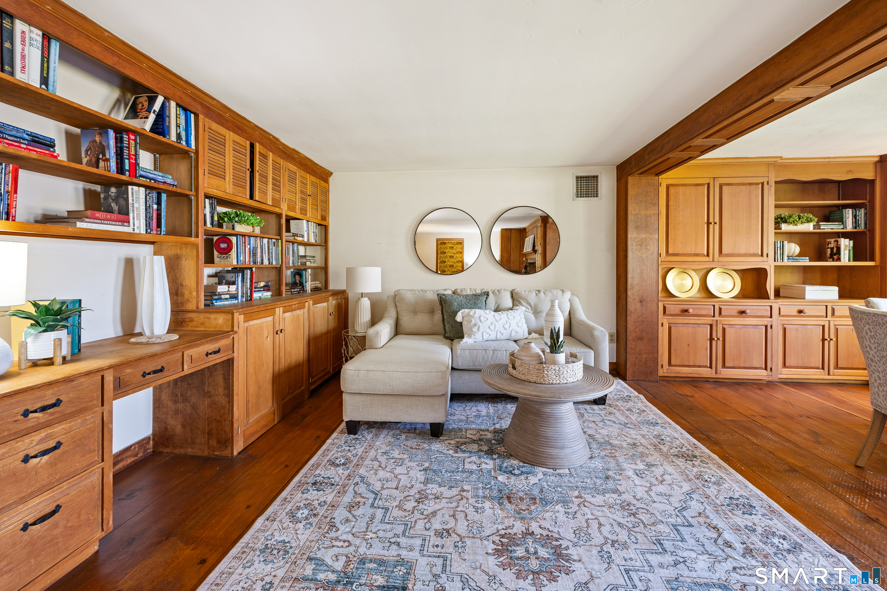 52 Susan Lane Meriden, CT 06450 - Photo 6 of 28 a living room with furniture and a book shelf