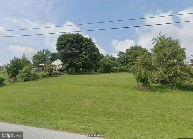 a view of a field with an outdoor space