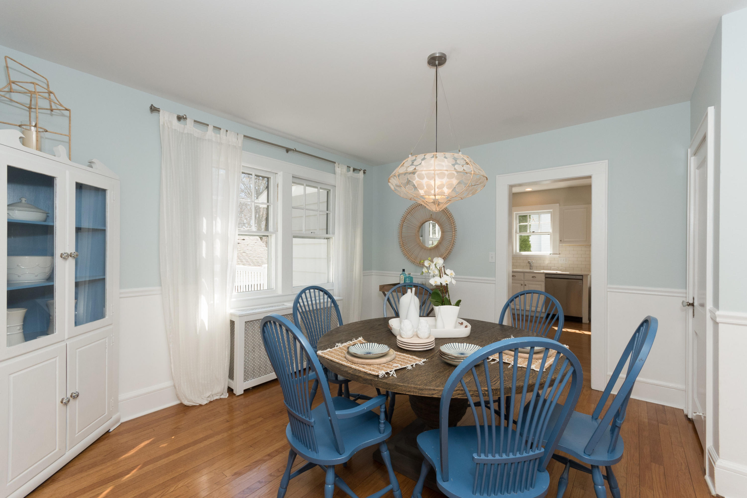 12 Maple Street Darien, CT 06820 - Photo 13 of 42 a dining room with furniture a chandelier and wooden floor