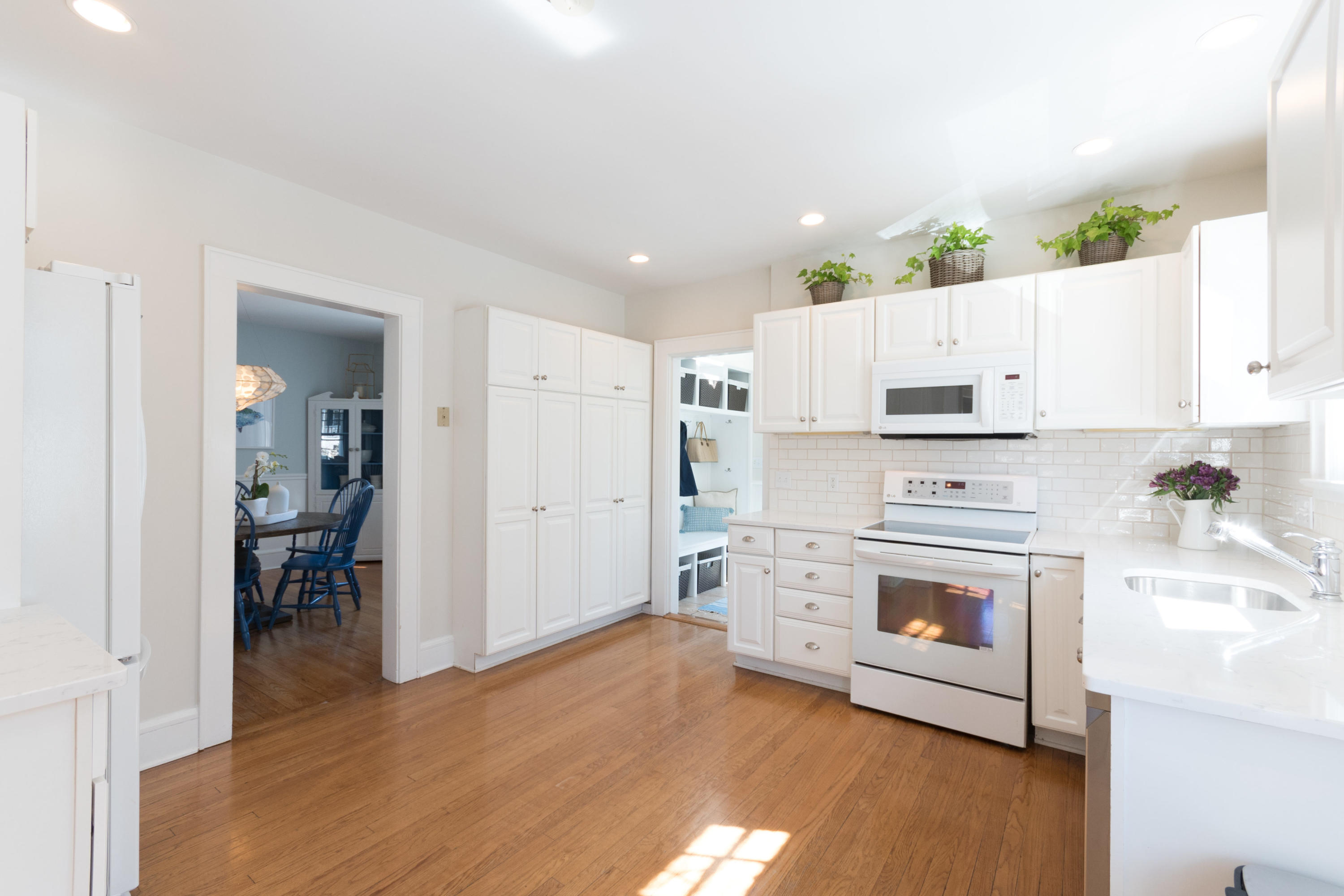 12 Maple Street Darien, CT 06820 - Photo 18 of 42 a kitchen with cabinets appliances and wooden floor