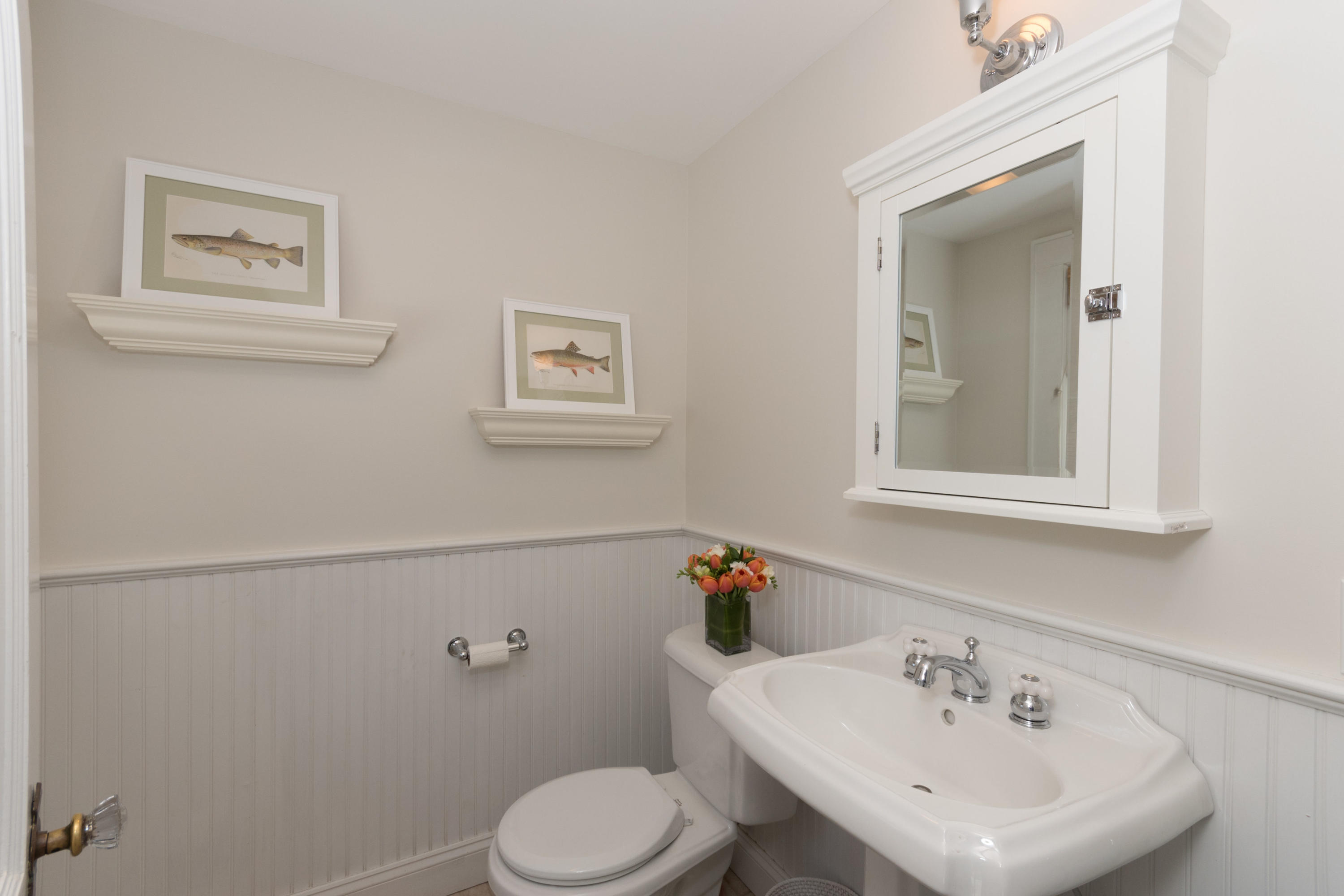 12 Maple Street Darien, CT 06820 - Photo 21 of 42 a bathroom with a sink mirror and toilet