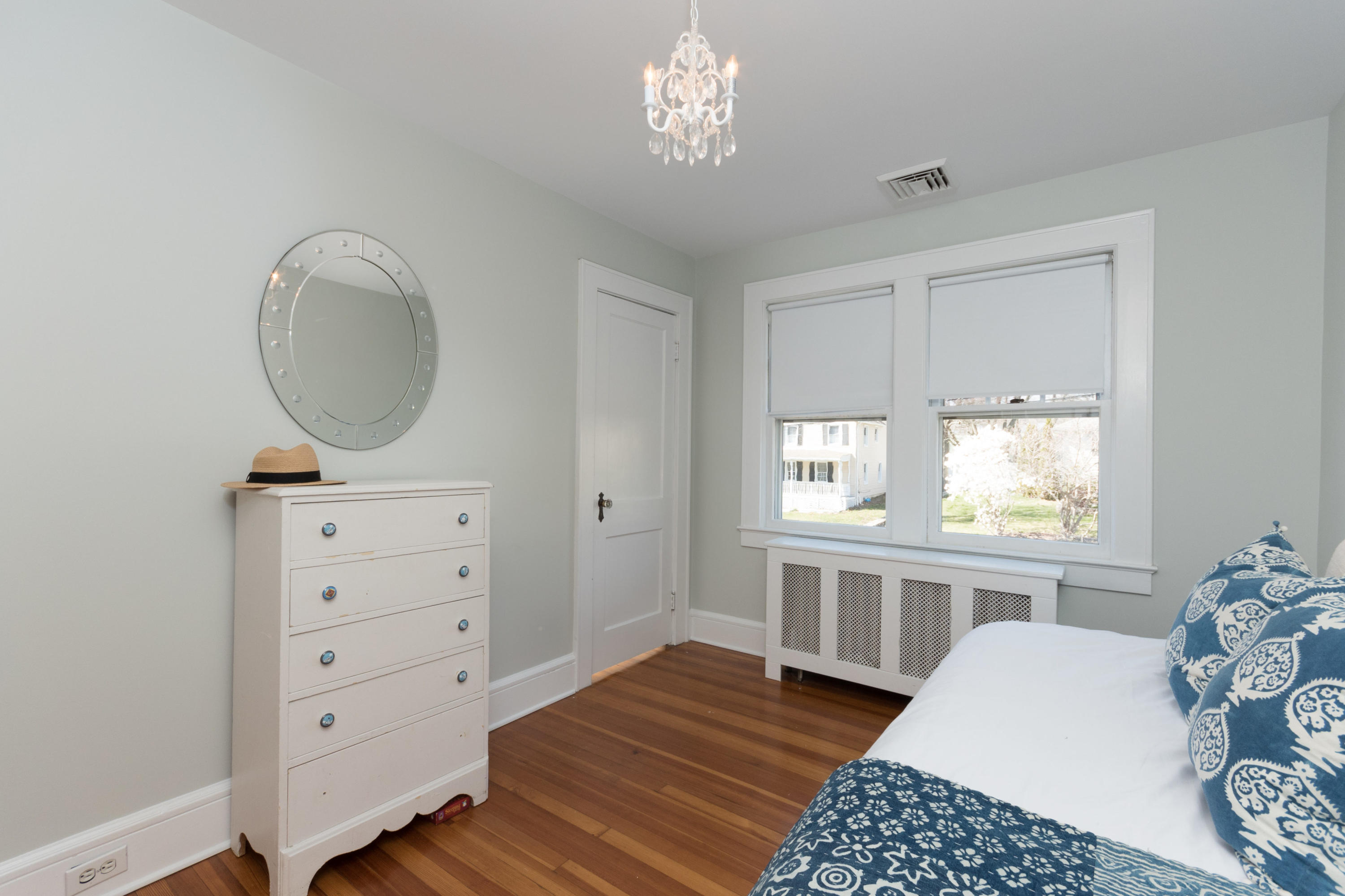 12 Maple Street Darien, CT 06820 - Photo 23 of 42 a bedroom with furniture and a window