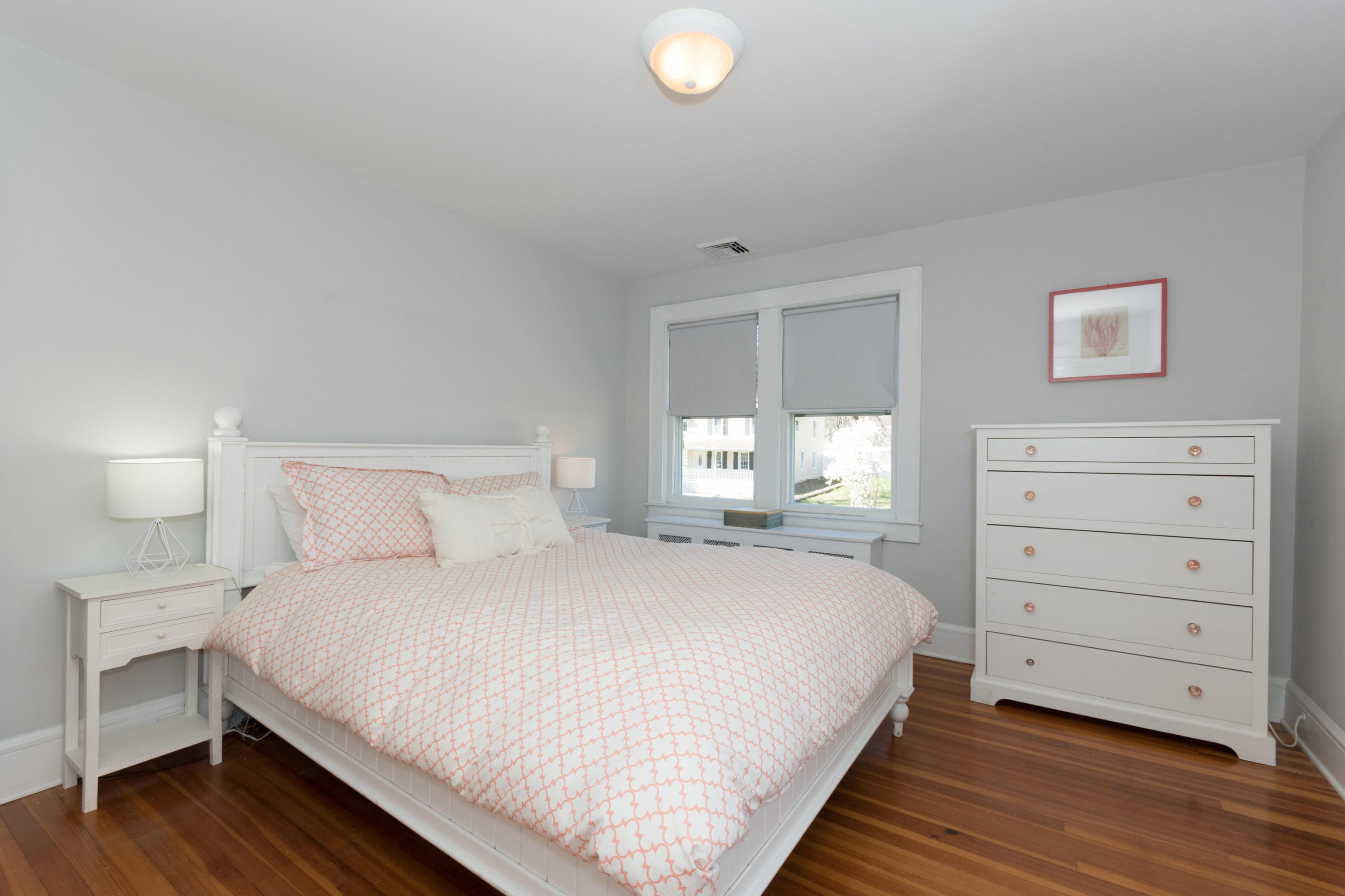 12 Maple Street Darien, CT 06820 - Photo 24 of 42 a bedroom with a bed and a window