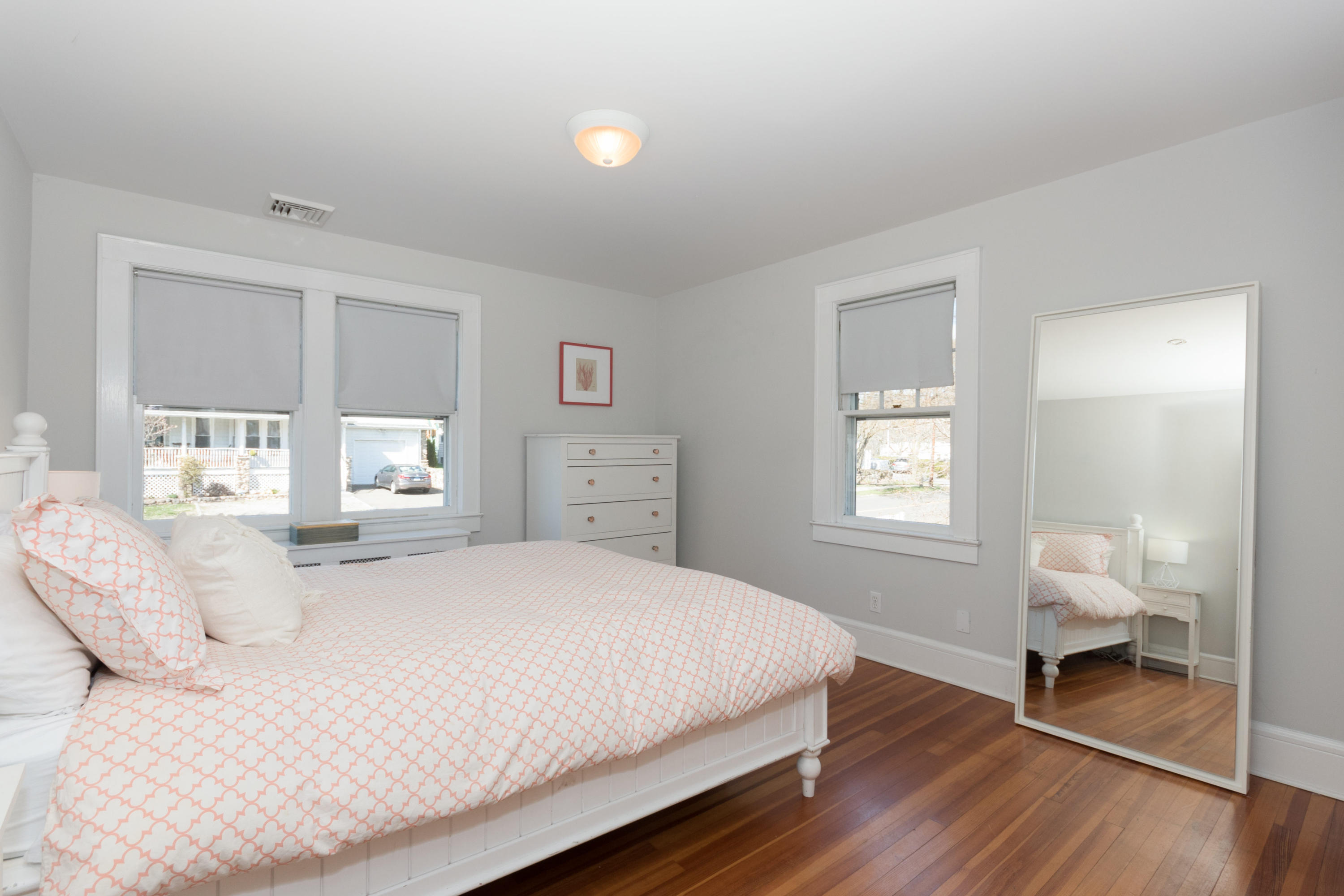 12 Maple Street Darien, CT 06820 - Photo 25 of 42 a bedroom with a bed and a window