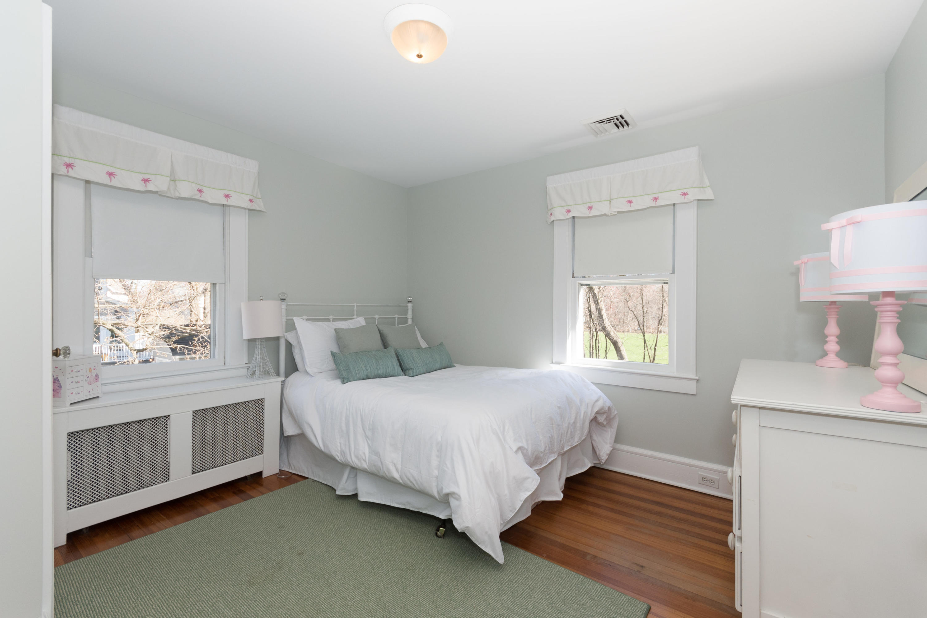 12 Maple Street Darien, CT 06820 - Photo 26 of 42 a bedroom with a bed window and a dresser