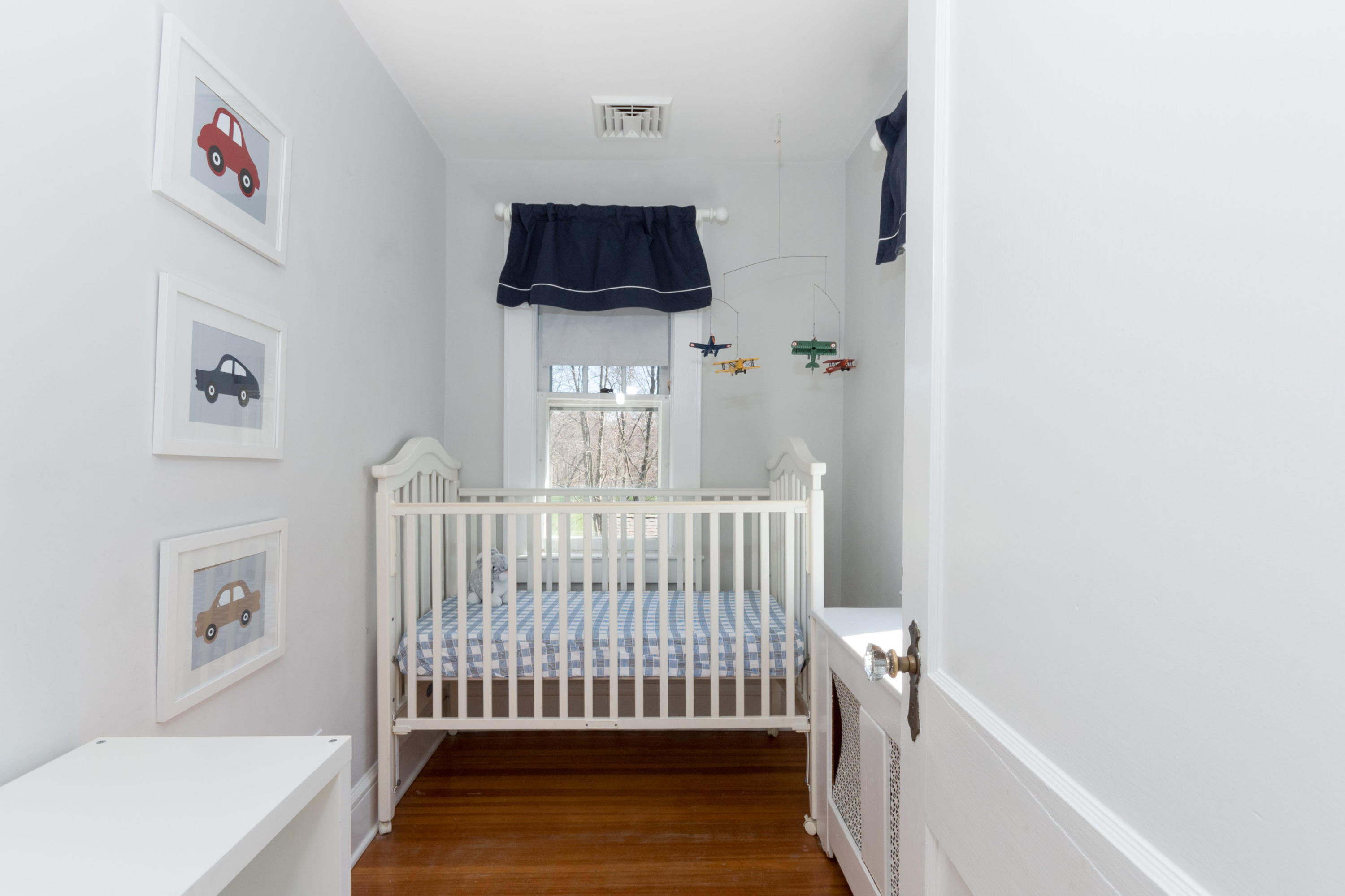 12 Maple Street Darien, CT 06820 - Photo 28 of 42 a bedroom with a bed and a window