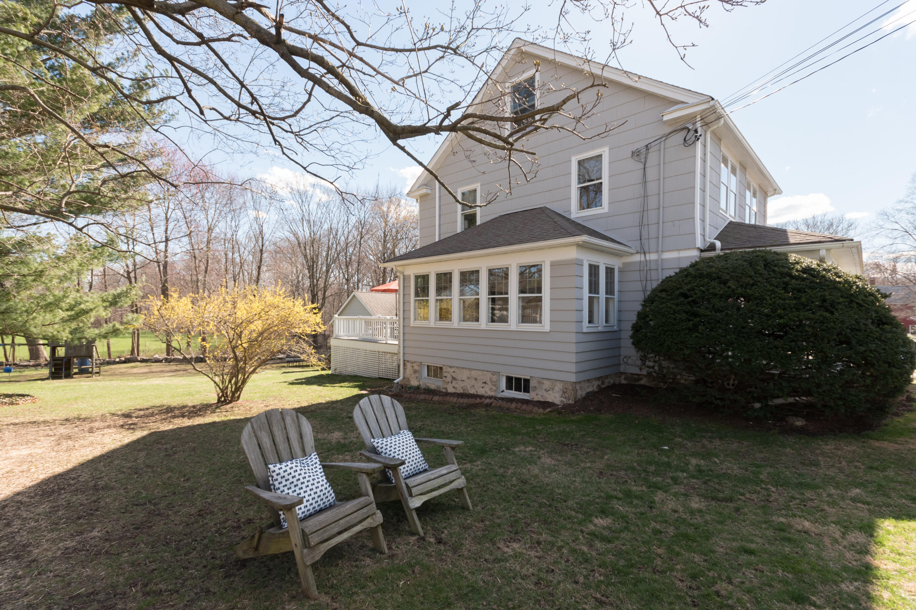 12 Maple Street Darien, CT 06820 - Photo 34 of 42 a view of a house with a yard and sitting area