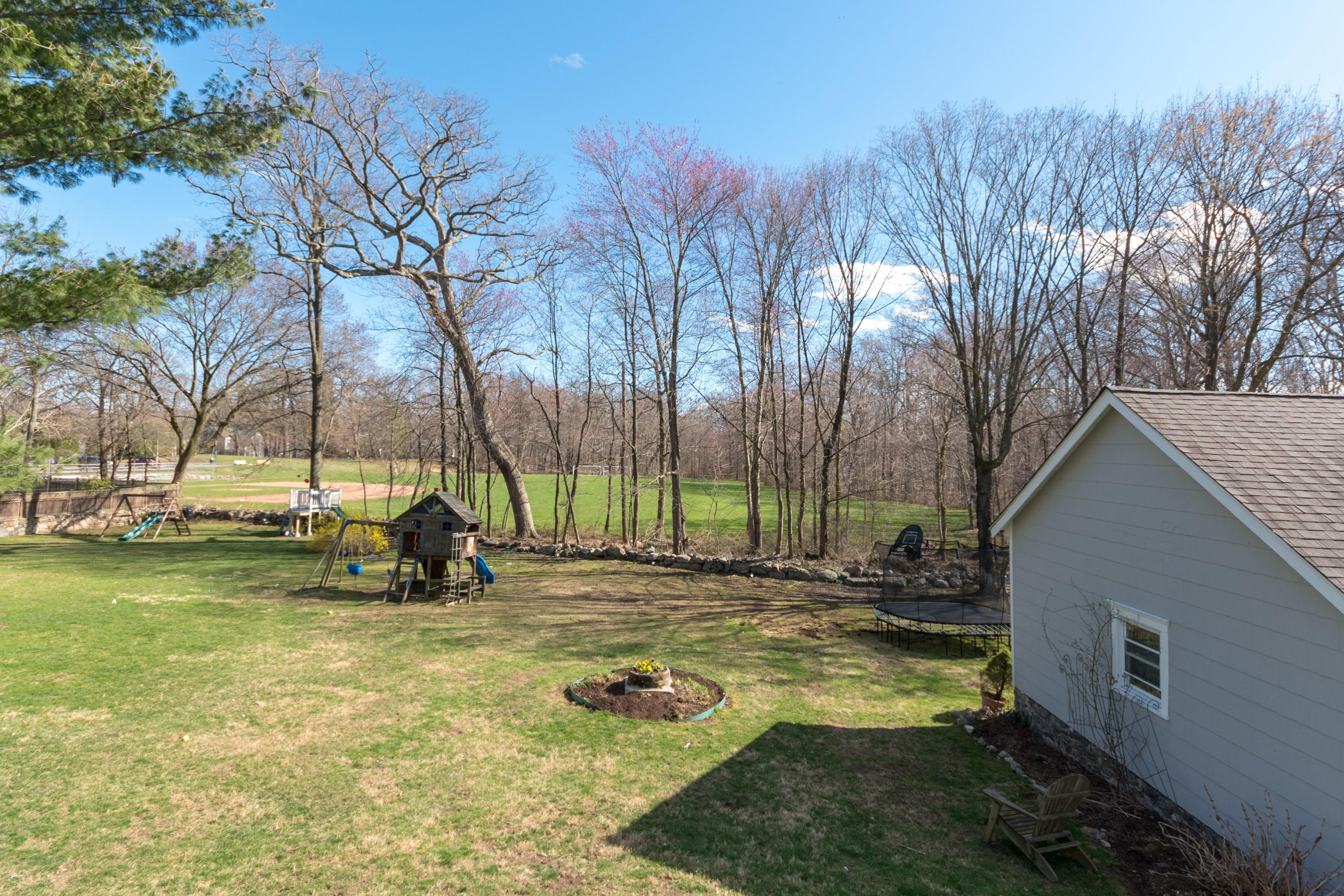 12 Maple Street Darien, CT 06820 - Photo 36 of 42 a view of a backyard with swimming pool