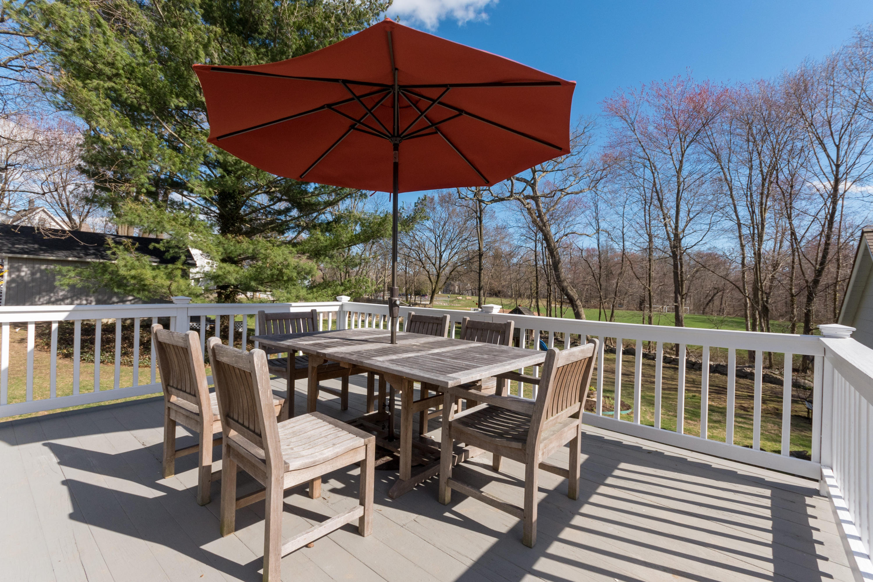 12 Maple Street Darien, CT 06820 - Photo 37 of 42 a view of a chairs and table under an umbrella