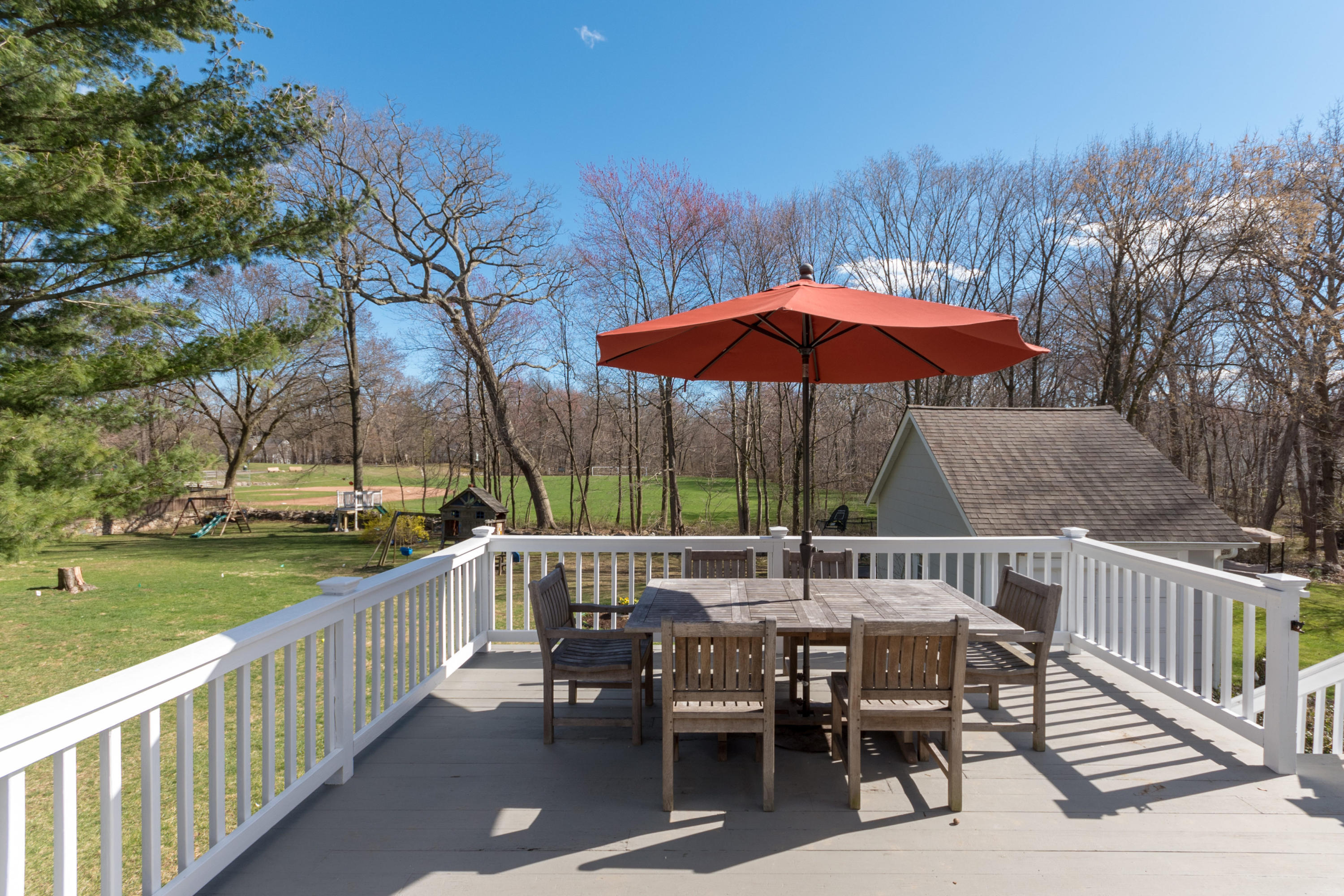 12 Maple Street Darien, CT 06820 - Photo 38 of 42 an outdoor space with furniture and umbrella
