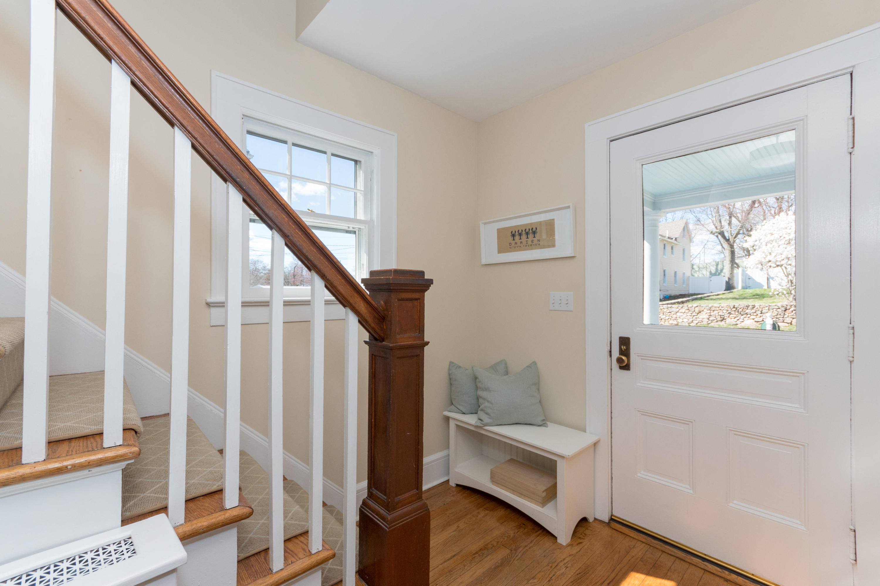 12 Maple Street Darien, CT 06820 - Photo 9 of 42 a view of entryway with wooden floor and stair