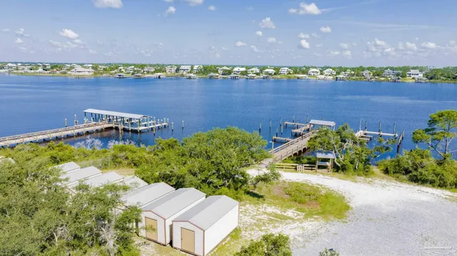 an aerial view of a house with a lake view