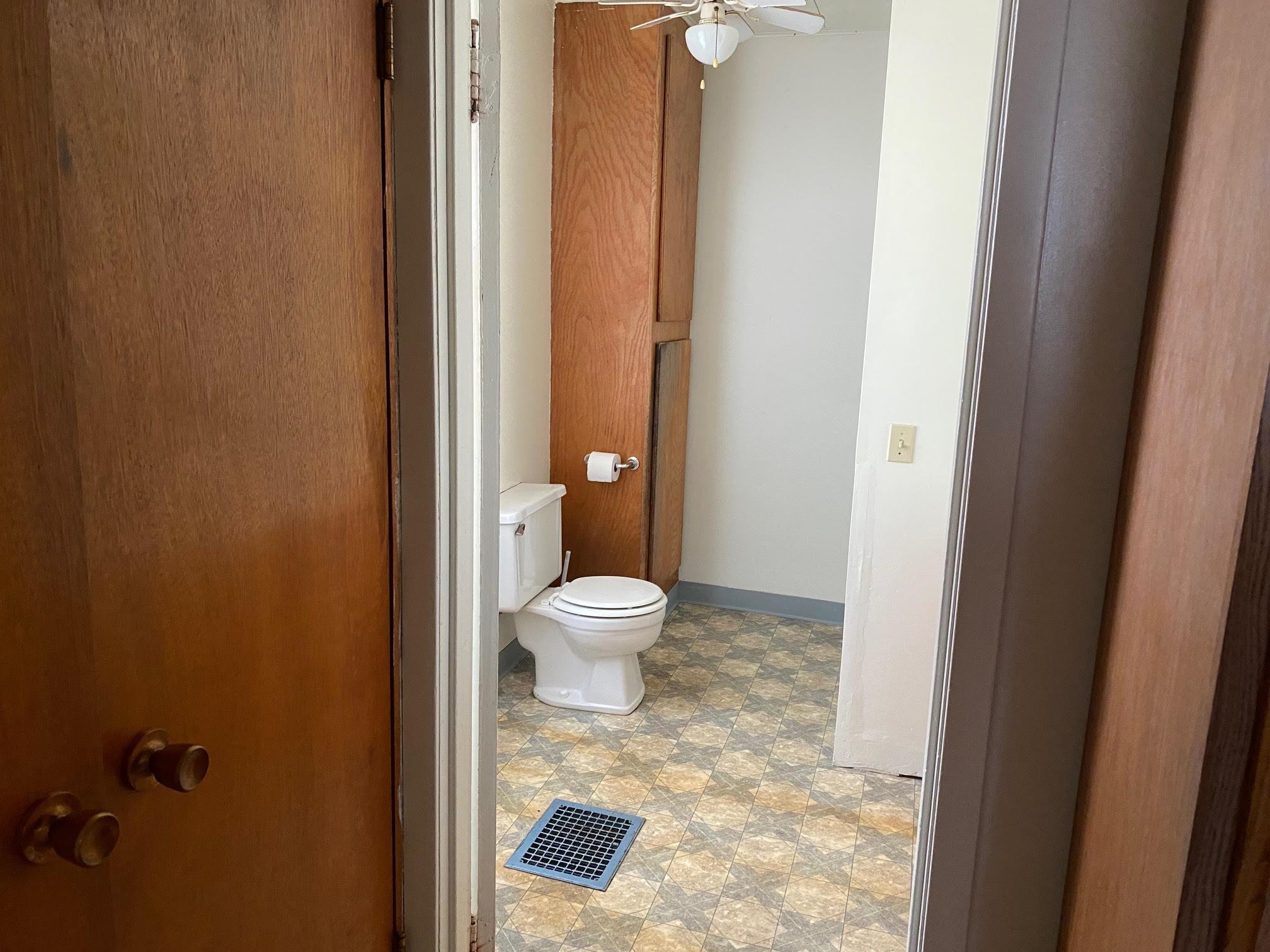 5604 Highway 20 Ridott, IL 61067 - Photo 11 of 15 a bathroom with a granite countertop toilet and a sink