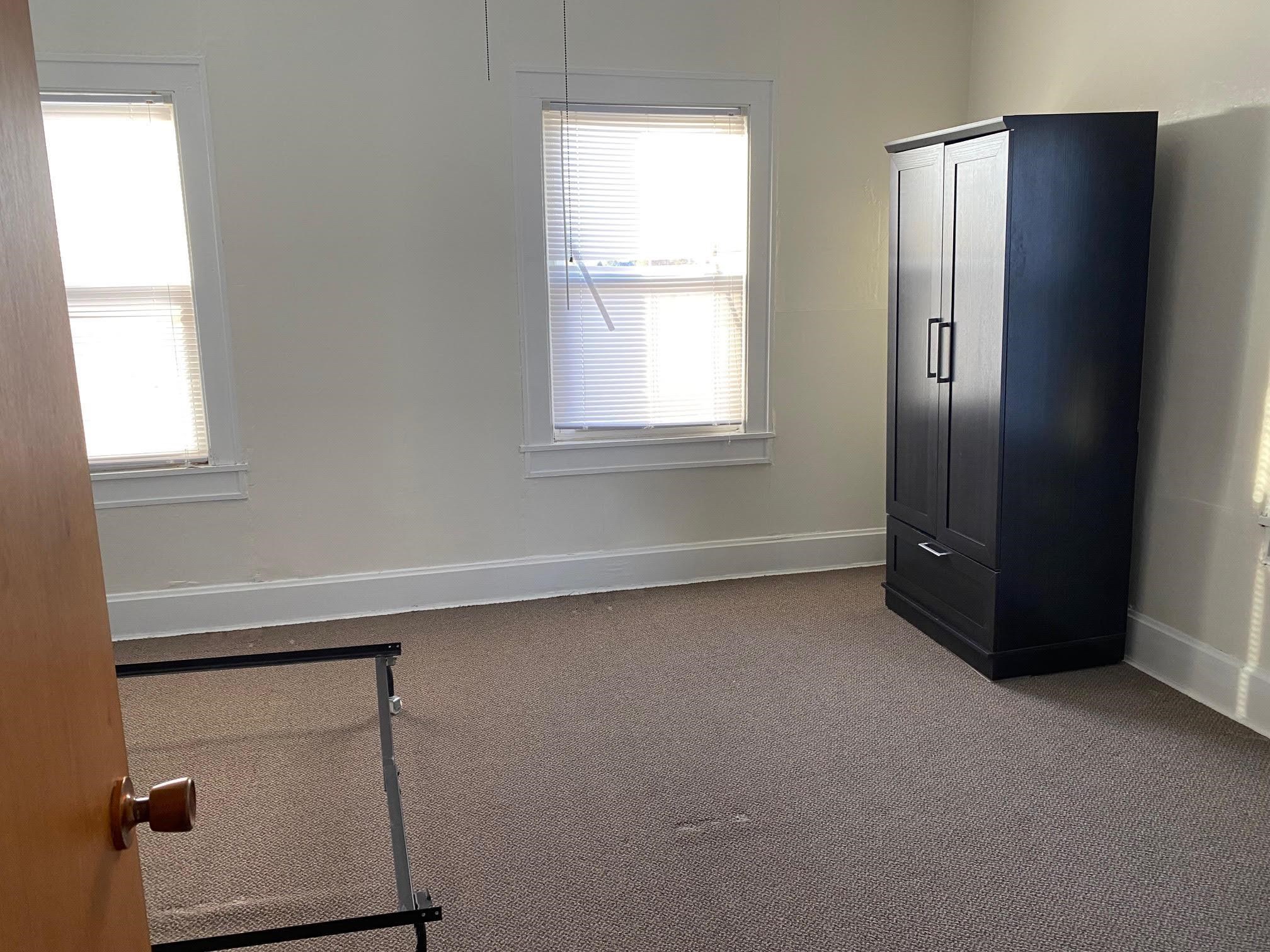 5604 Highway 20 Ridott, IL 61067 - Photo 9 of 15 a room with a window and a refrigerator