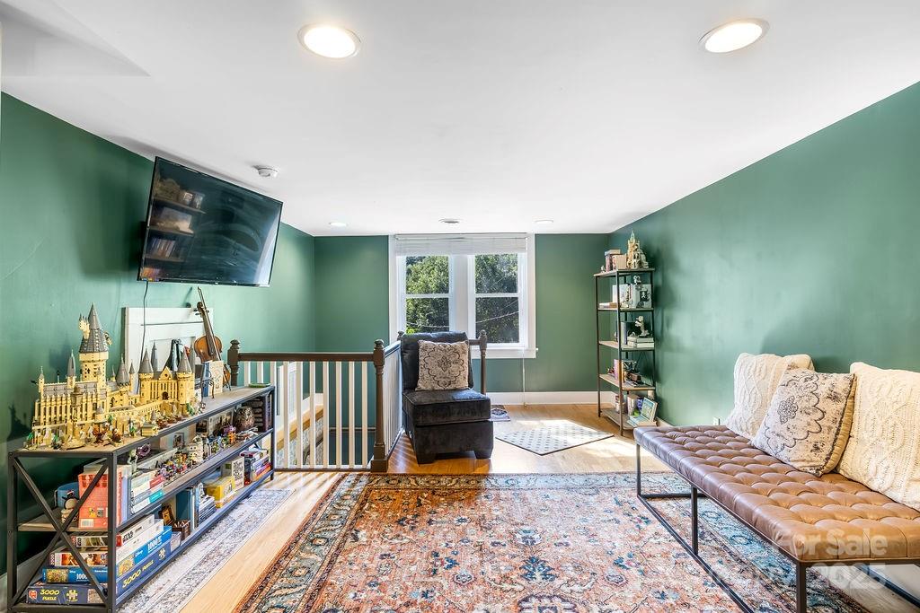 34 Coosa Rdg Drive Whittier, NC 28789 - Photo 16 of 33 a living room with furniture and a flat screen tv