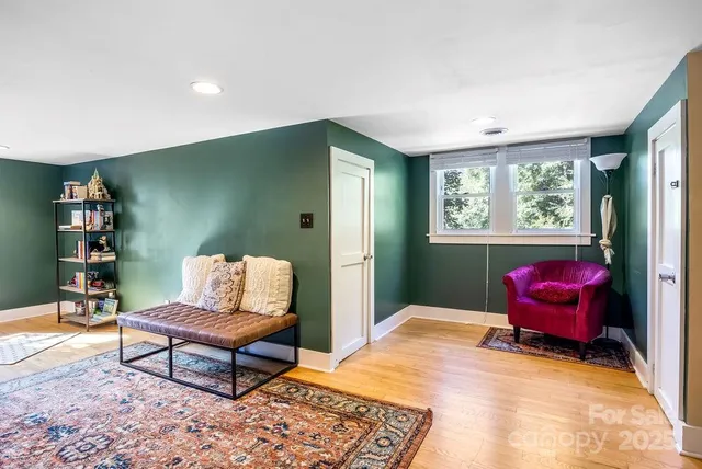 a bedroom with furniture and a window
