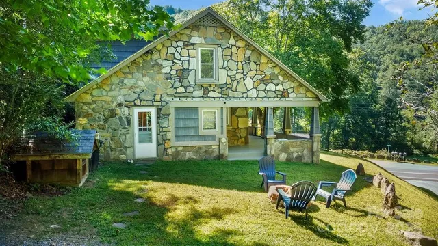 a view of a house with backyard porch and sitting area