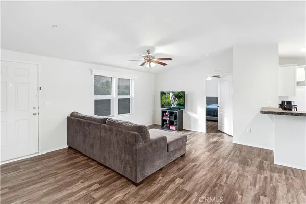 a living room with furniture and a large window