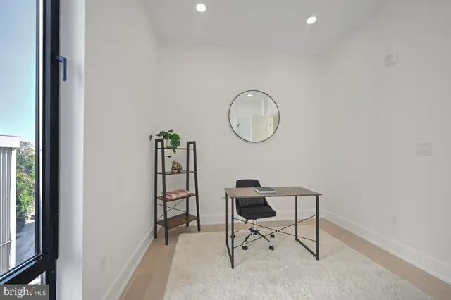 a view of a room with table and a chair