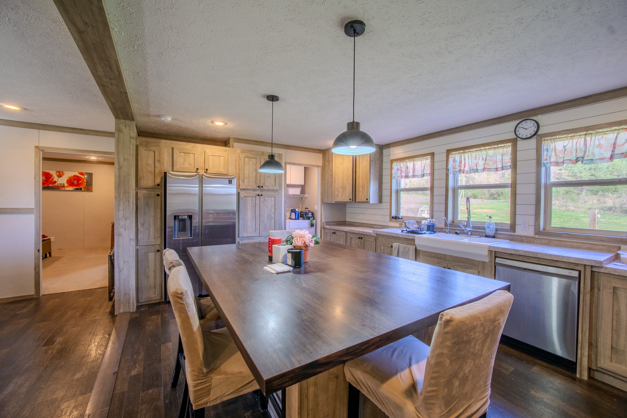 316 Morris Demps Road Sparta, TN 38583 - Photo 19 of 55 a view of a dining room and livingroom with furniture wooden floor a chandelier