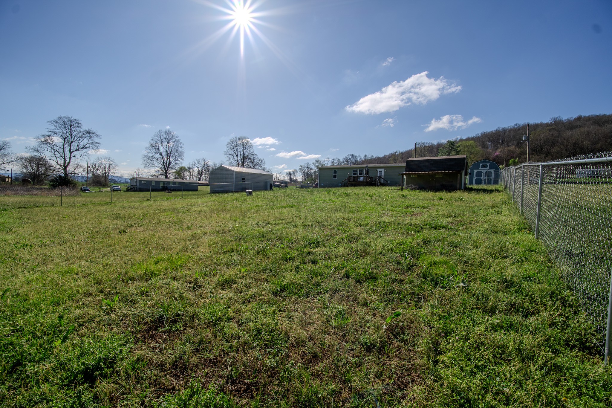 316 Morris Demps Road Sparta, TN 38583 - Photo 40 of 55 a backyard of a house with table and chairs