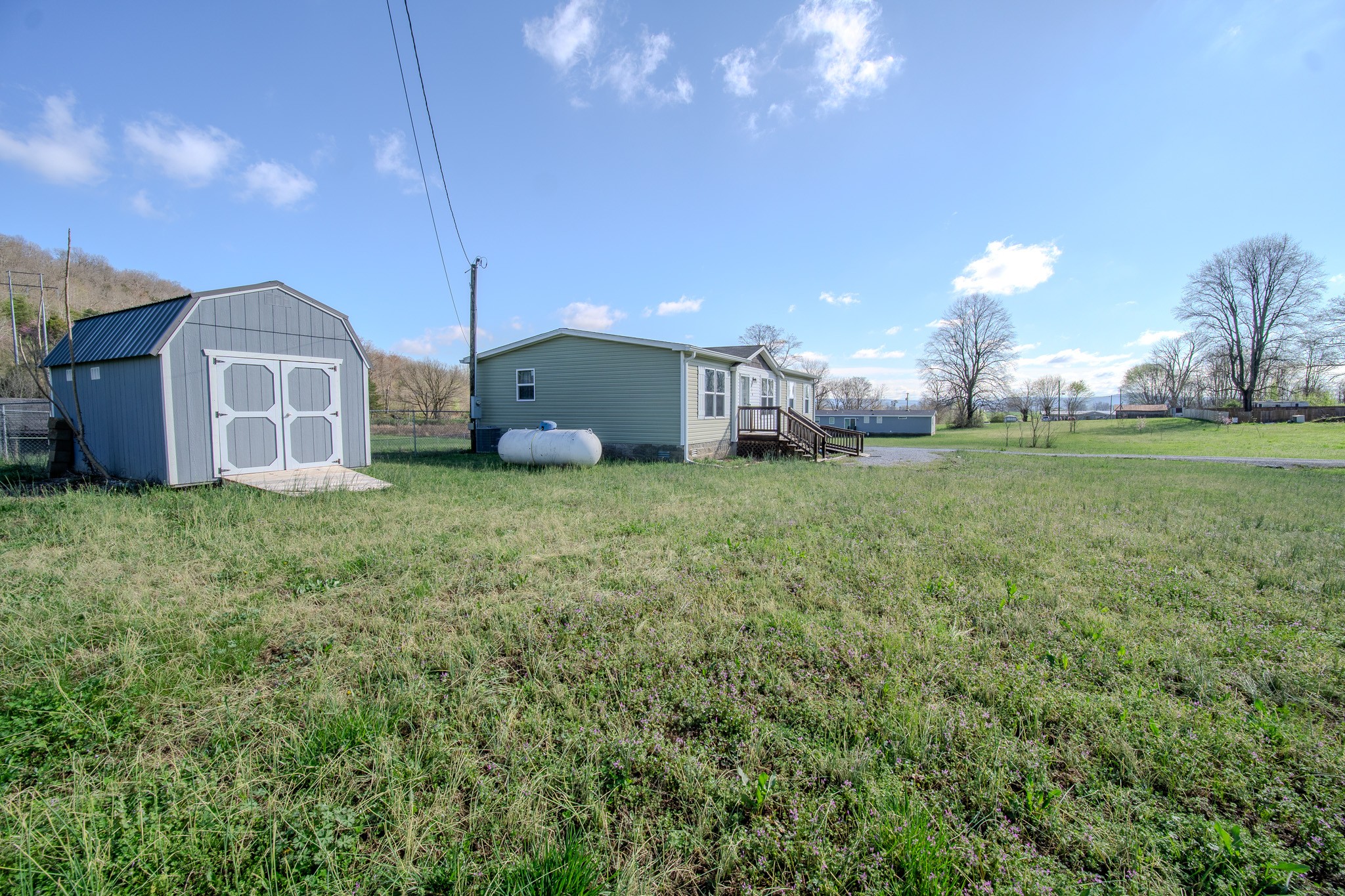 316 Morris Demps Road Sparta, TN 38583 - Photo 44 of 55 a view of a house with a yard and a view of a house
