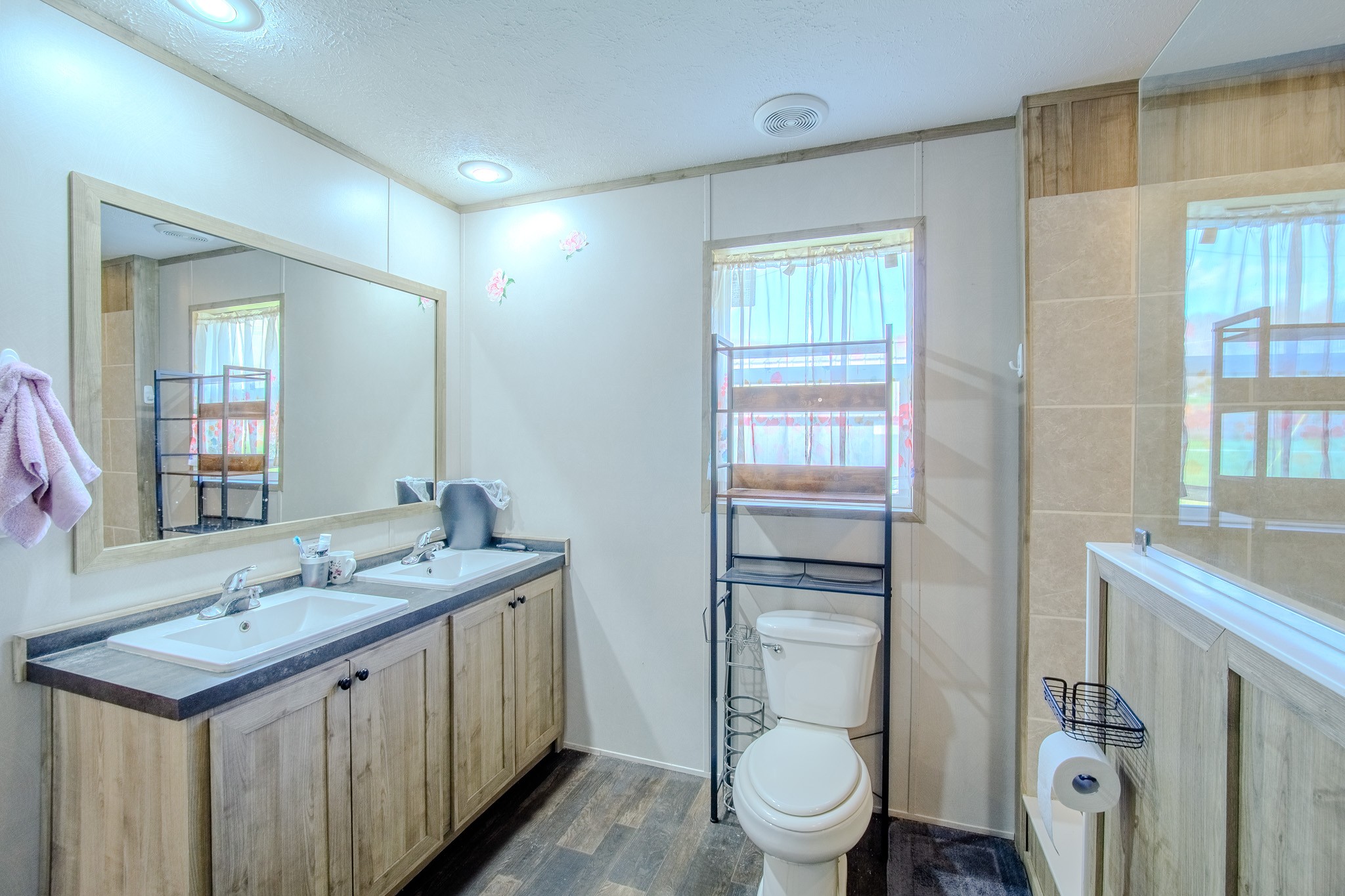 316 Morris Demps Road Sparta, TN 38583 - Photo 10 of 55 a bathroom with a granite countertop sink toilet and shower