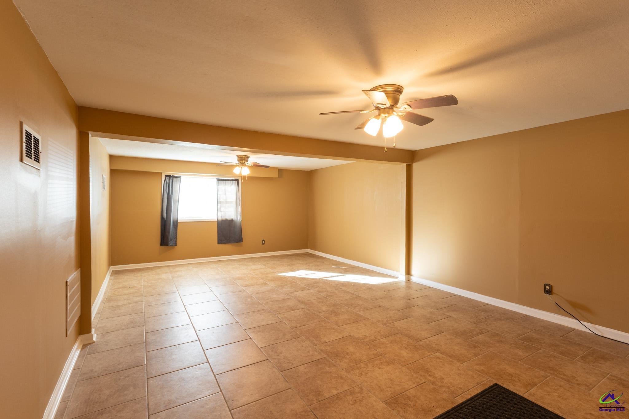 3491 Sandy Circle Macon, GA 31216 - Photo 19 of 47 a view of empty room with a ceiling fan