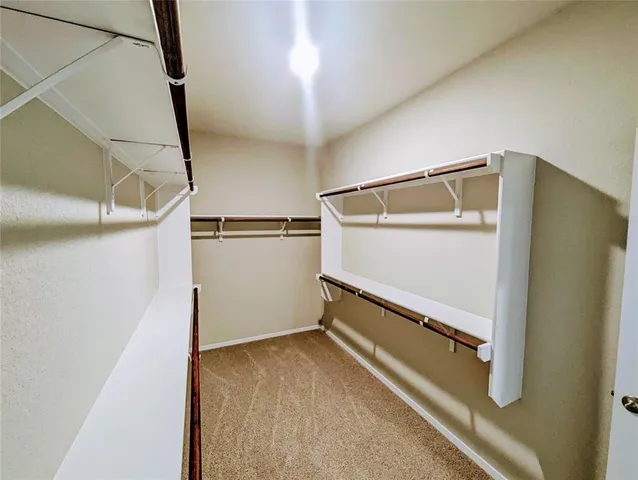 a bathroom with a double vanity sink and mirror