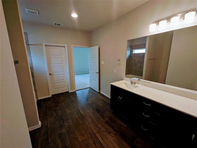 a bathroom with a bathtub and a sink