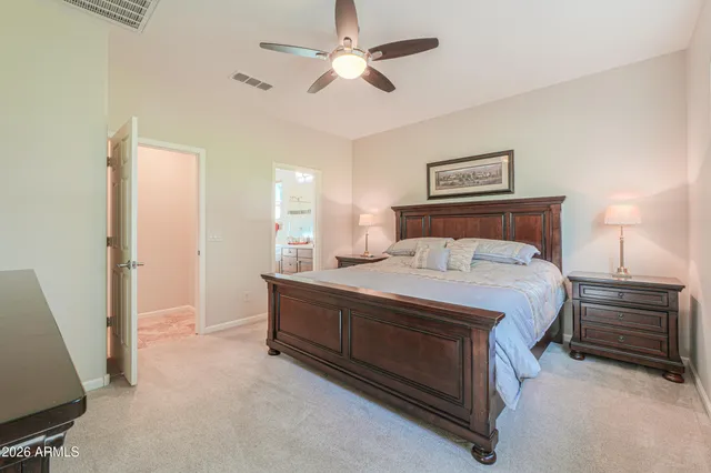 a spacious bathroom with a shower sink and mirror