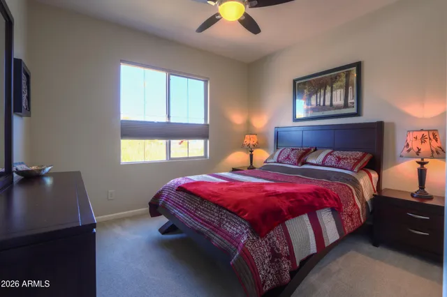 a bedroom with a bed and a dresser