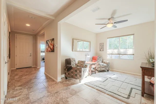 a living room with furniture and a window
