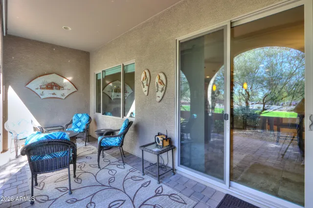 a view of backyard with plants and outdoor seating