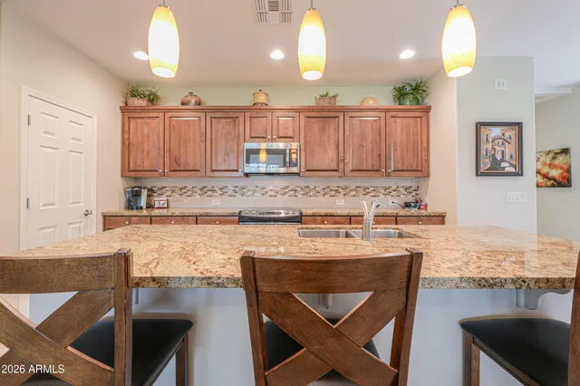 a view of a living room and kitchen