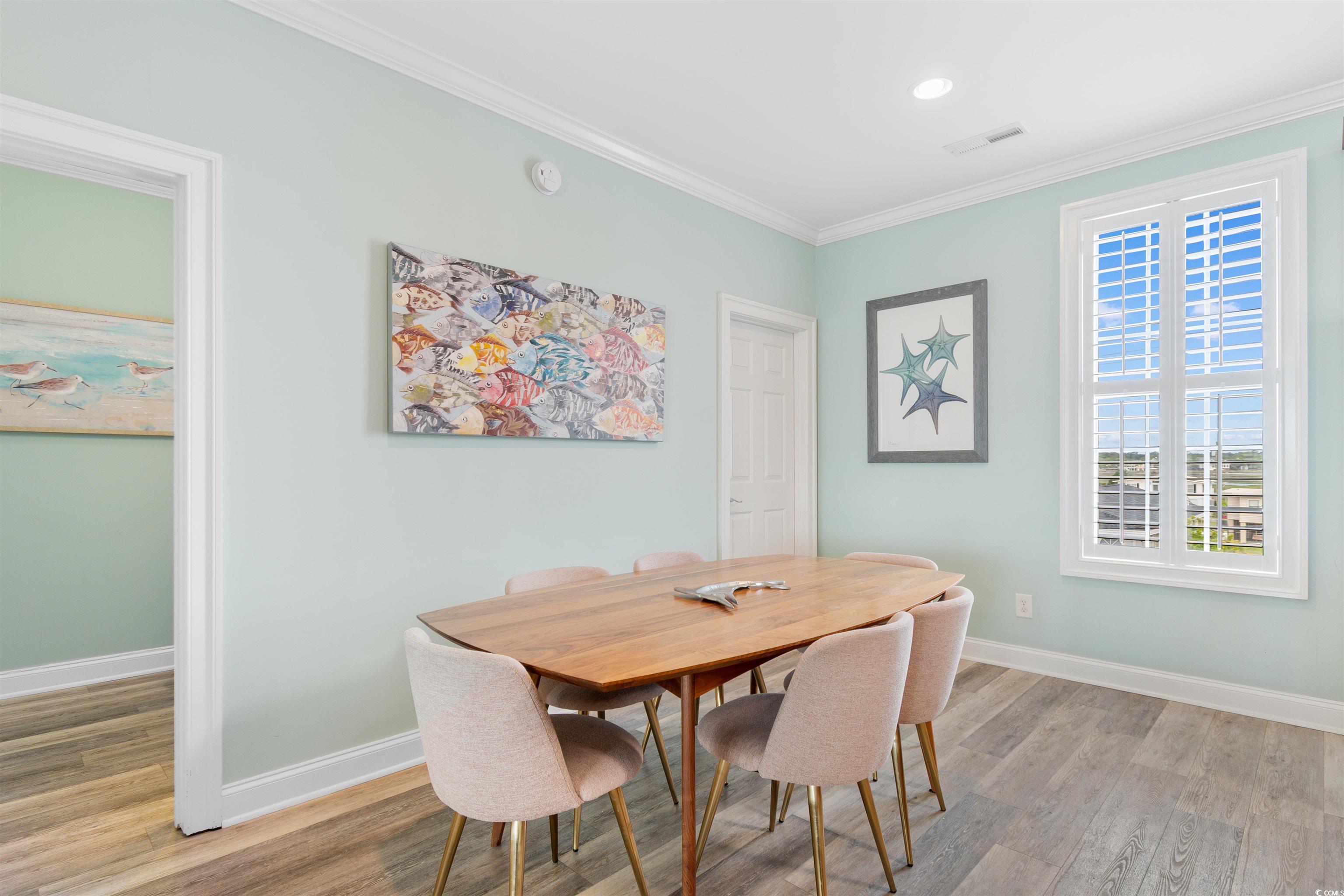 703 South Waccamaw Drive Murrells Inlet, SC 29576 - Photo 16 of 40 Dining space with light wood-style flooring