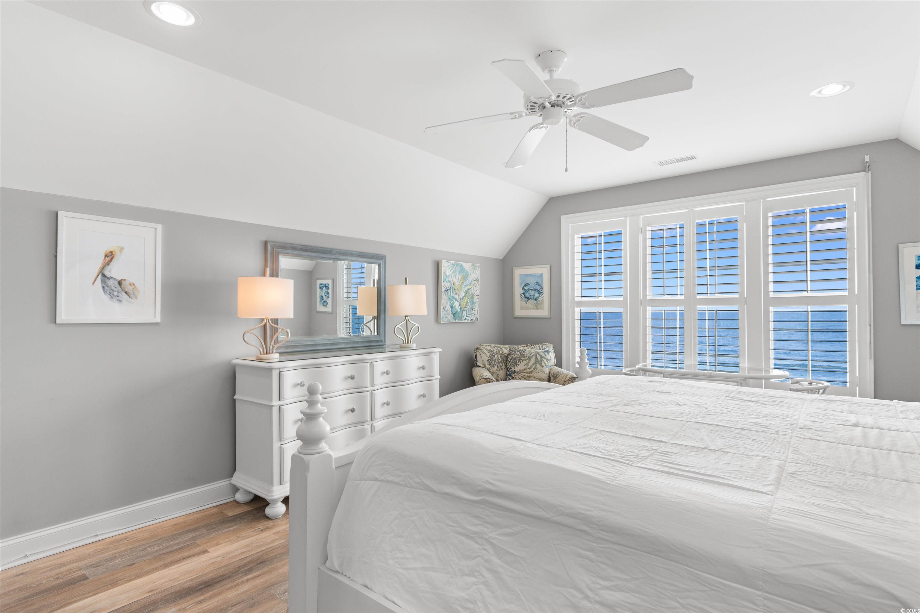 703 South Waccamaw Drive Murrells Inlet, SC 29576 - Photo 25 of 40 Bedroom with baseboards, wood finished floors, vaulted ceiling, recessed lighting, and ceiling fan