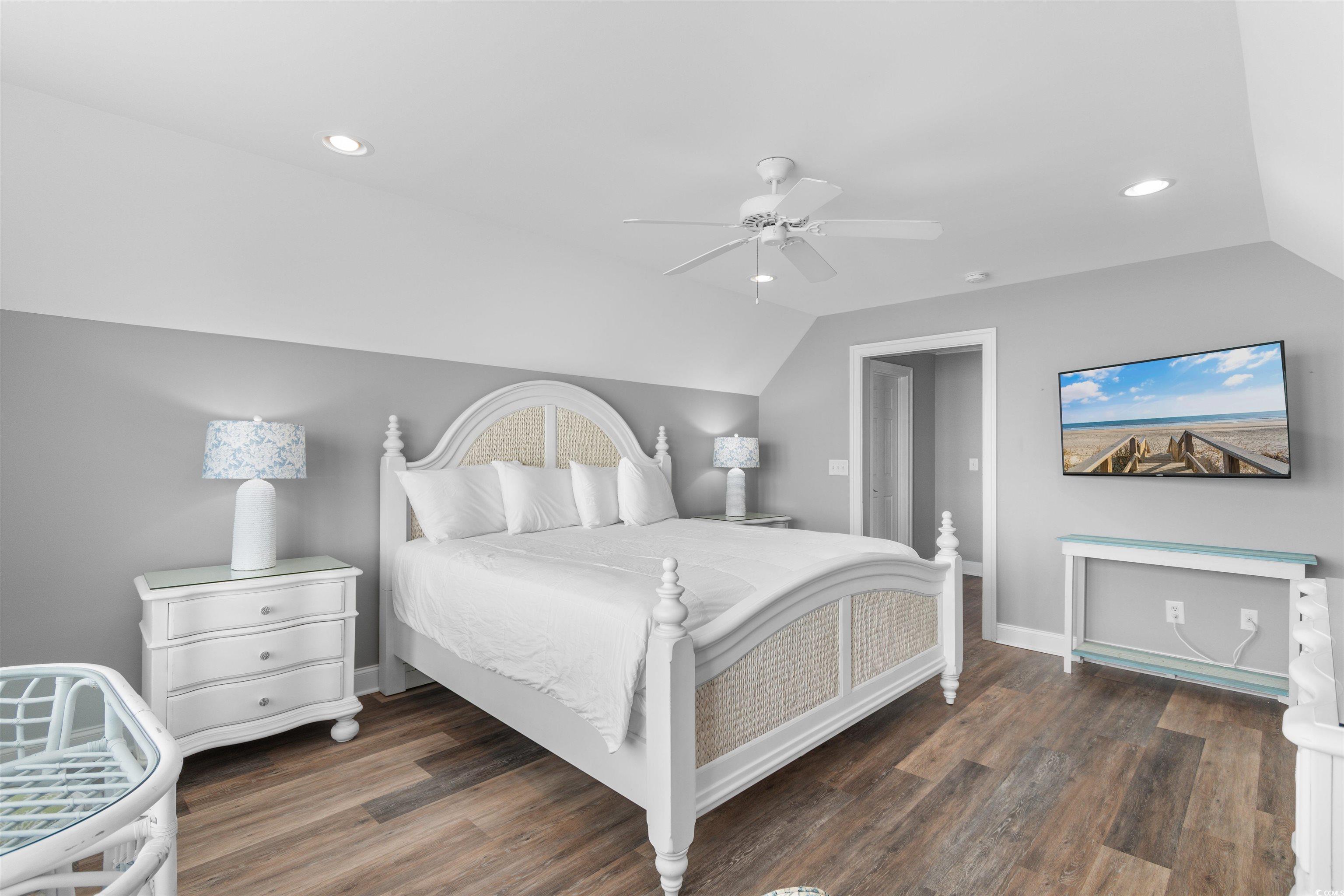703 South Waccamaw Drive Murrells Inlet, SC 29576 - Photo 26 of 40 Oceanfront Primary Bedroom featuring vaulted ceiling, wood finished floors, recessed lighting, a ceiling fan,